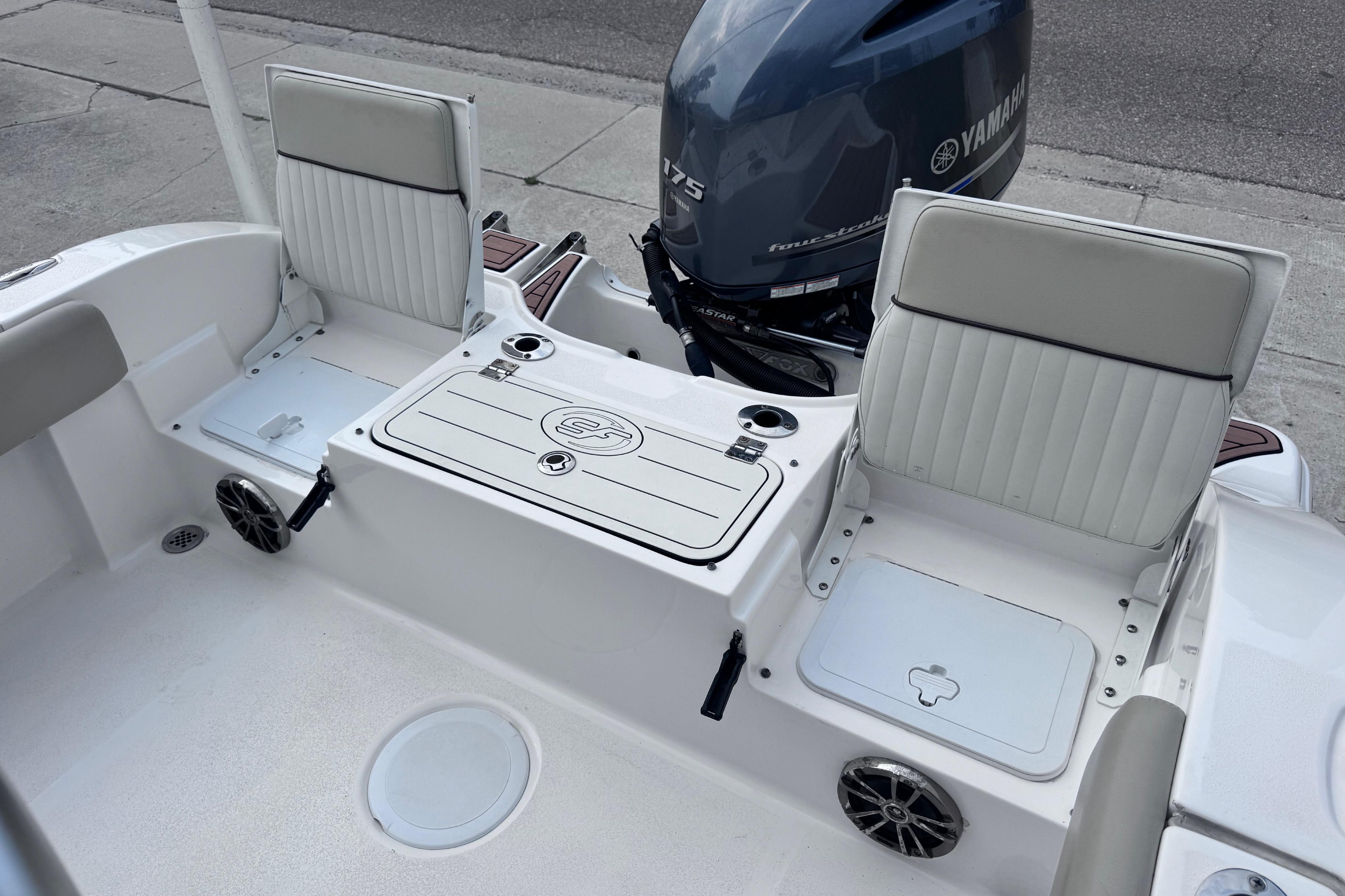 2018 Sea Fox 206 Commander boat interior with Yamaha engine, featuring seating and storage compartments.