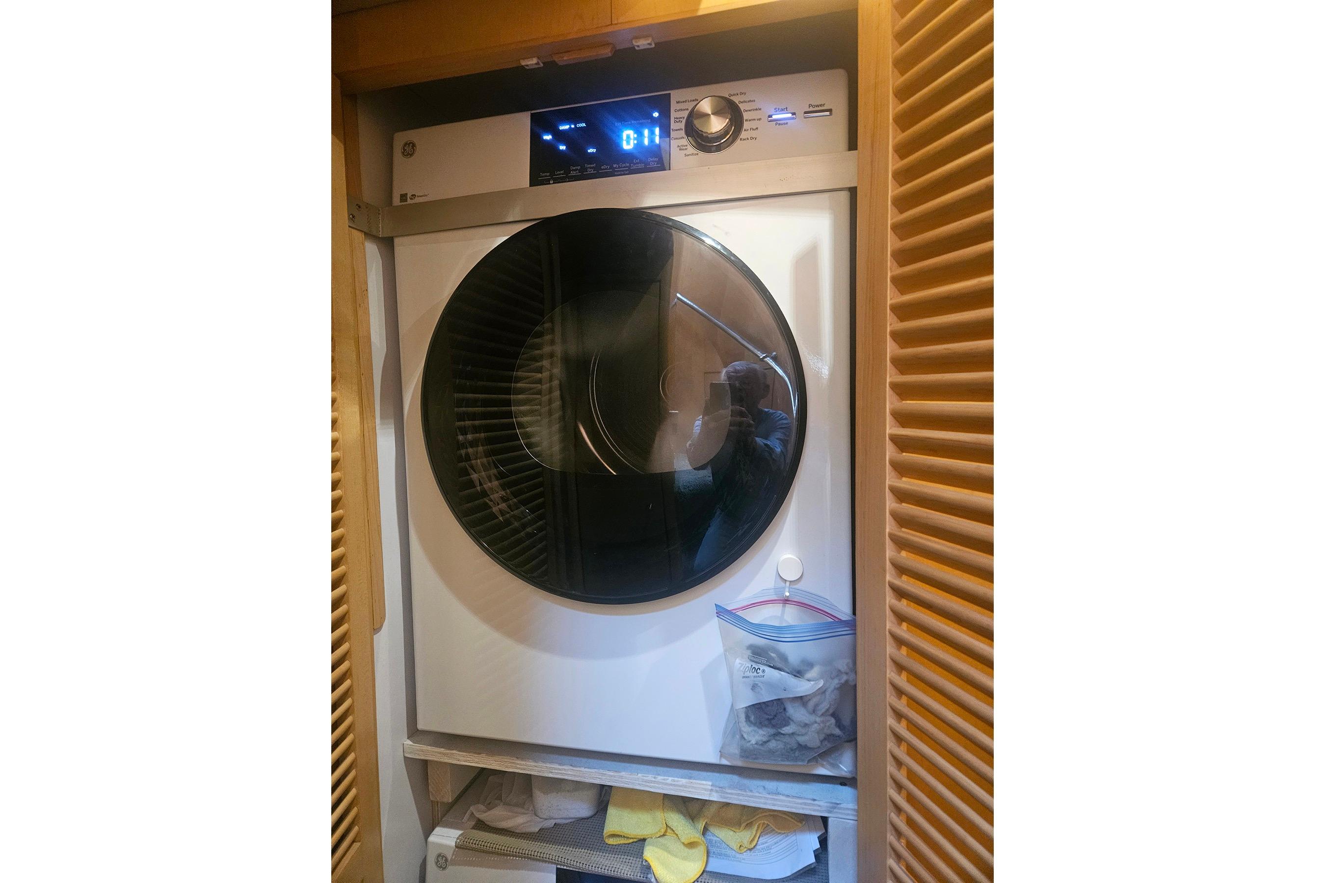 Front-loading washing machine in a wooden cabinet, Symbol 55 model, 1995.