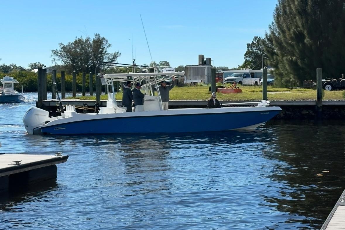 2021 Custom Infusion 34 CC boat docked on a sunny day.