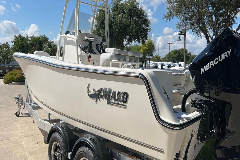 2026 Mako 214 Center Console boat on trailer, featuring Mercury outboard motor.