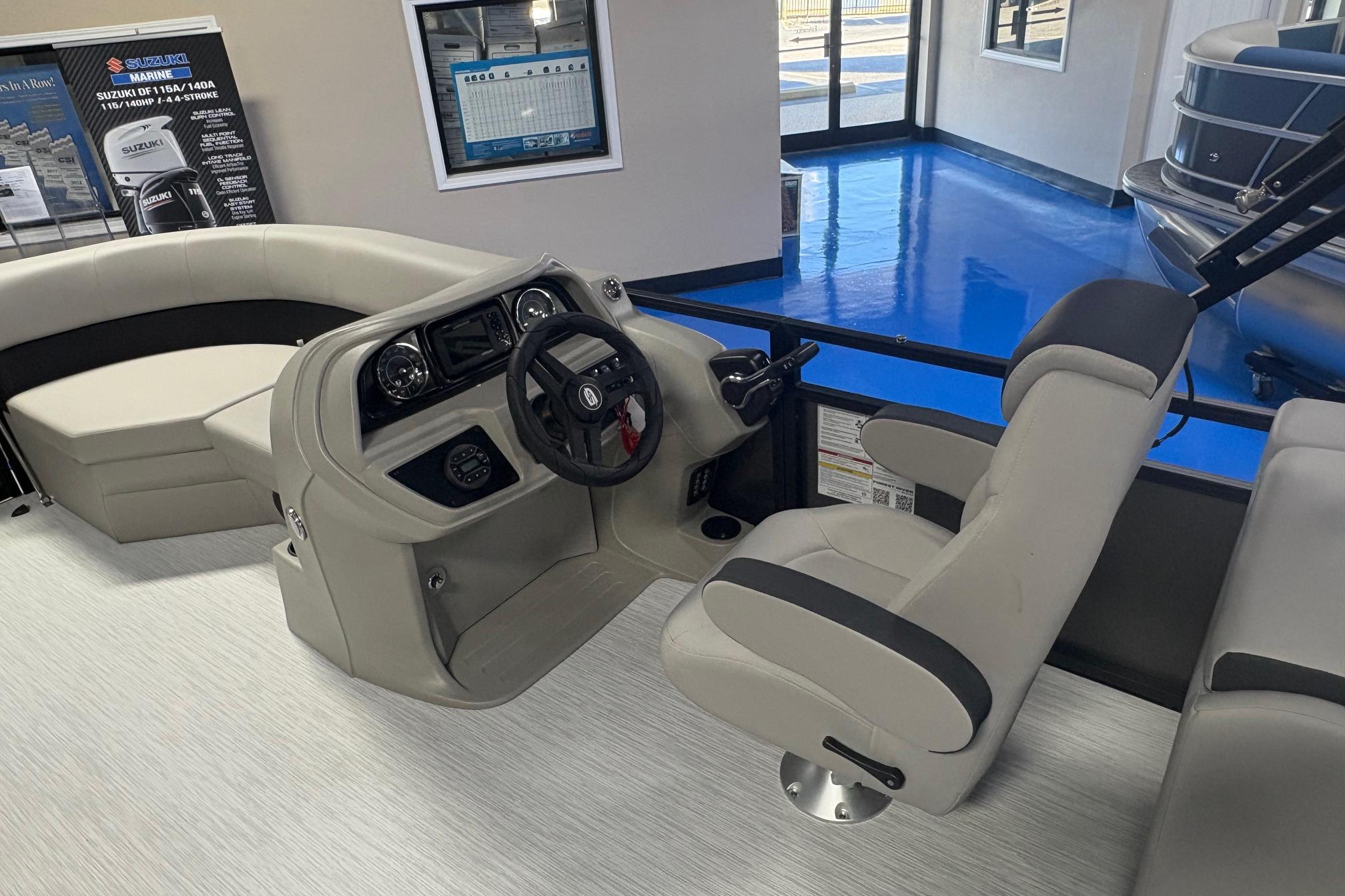 Interior of 2026 Dockside 22DQ boat with steering console and seating.