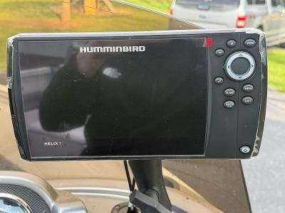 A Humminbird Helix 7 fish finder on a boat.