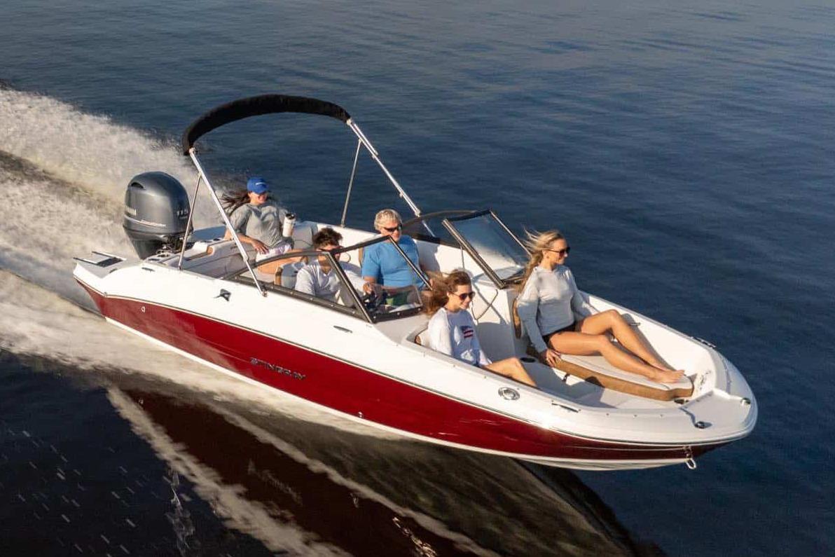 Manufacturer Provided Image: 2026 Stingray 191 DC boat cruising on water with passengers enjoying the ride.
