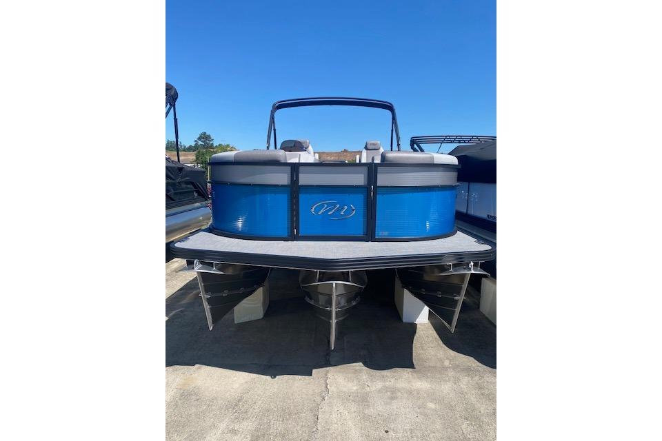2026 Manitou 23 AURORA RF VPII 575 pontoon boat, blue exterior, docked outdoors.