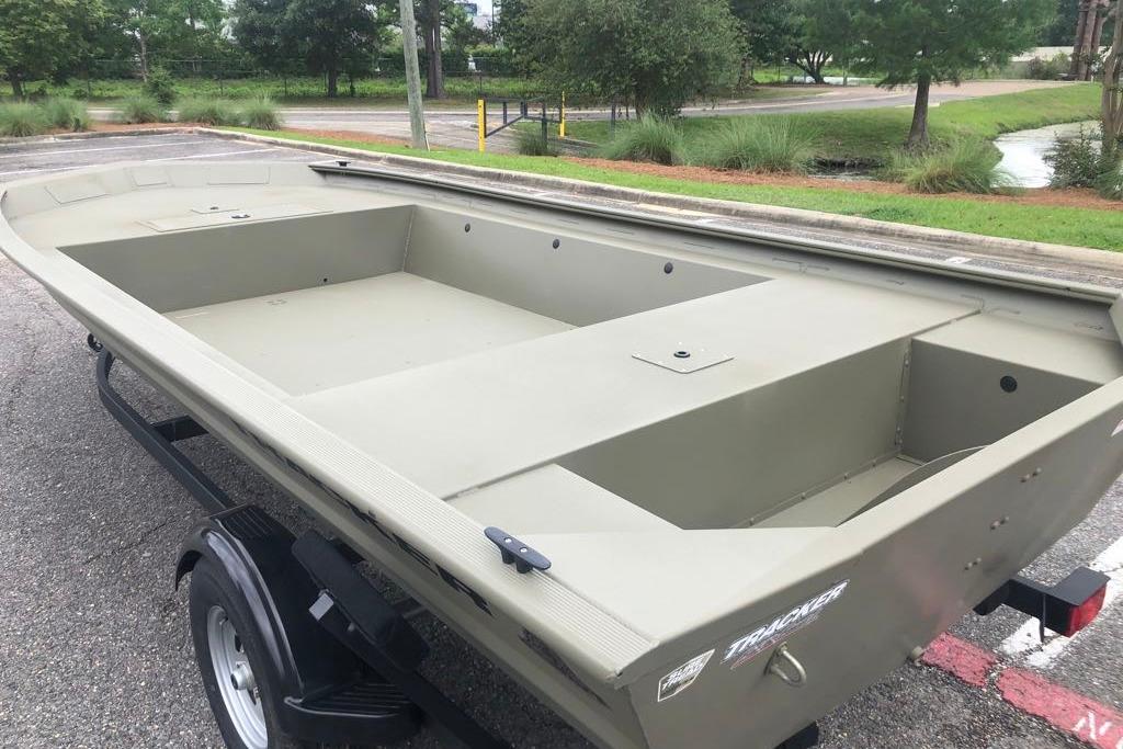 2026 Tracker Grizzly 1754 Utility boat on trailer, parked outdoors.