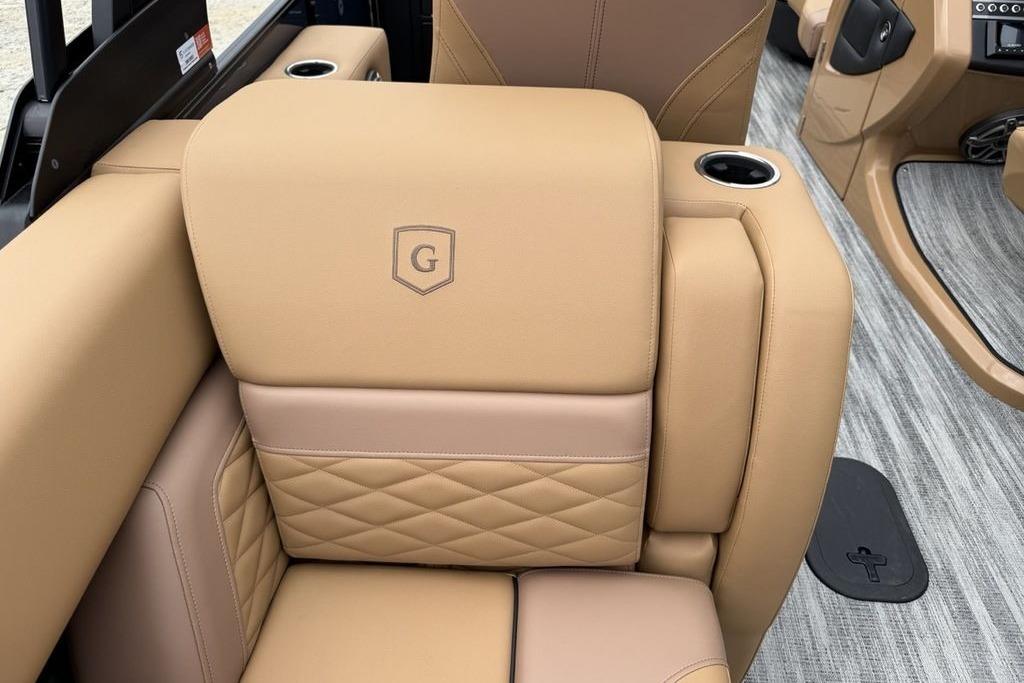 Luxurious tan seating in 2026 Godfrey Monaco 235 SFLC iMPACT boat interior.