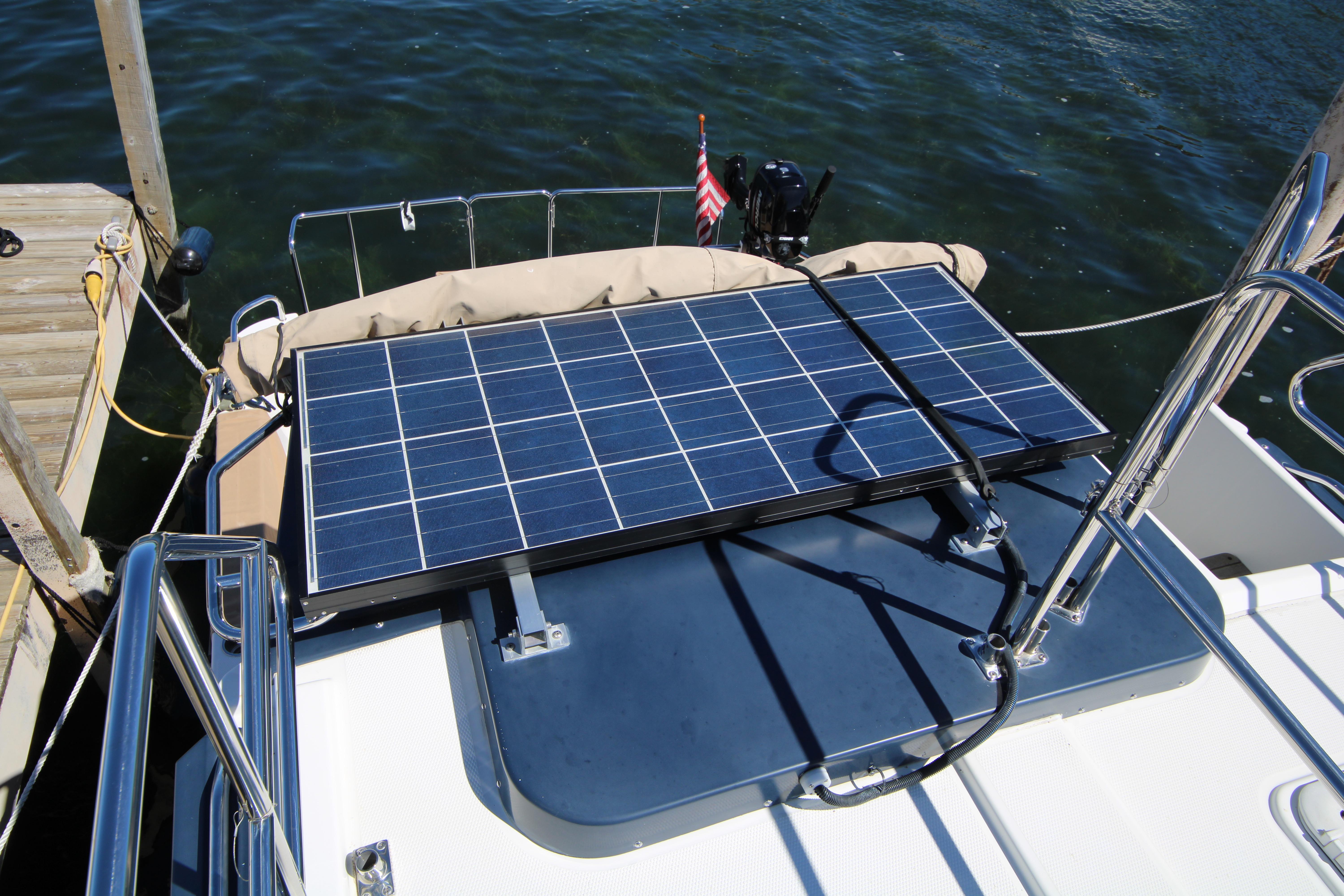Solar panel on 2013 Ranger Tugs R-31 CB boat deck, docked by water.