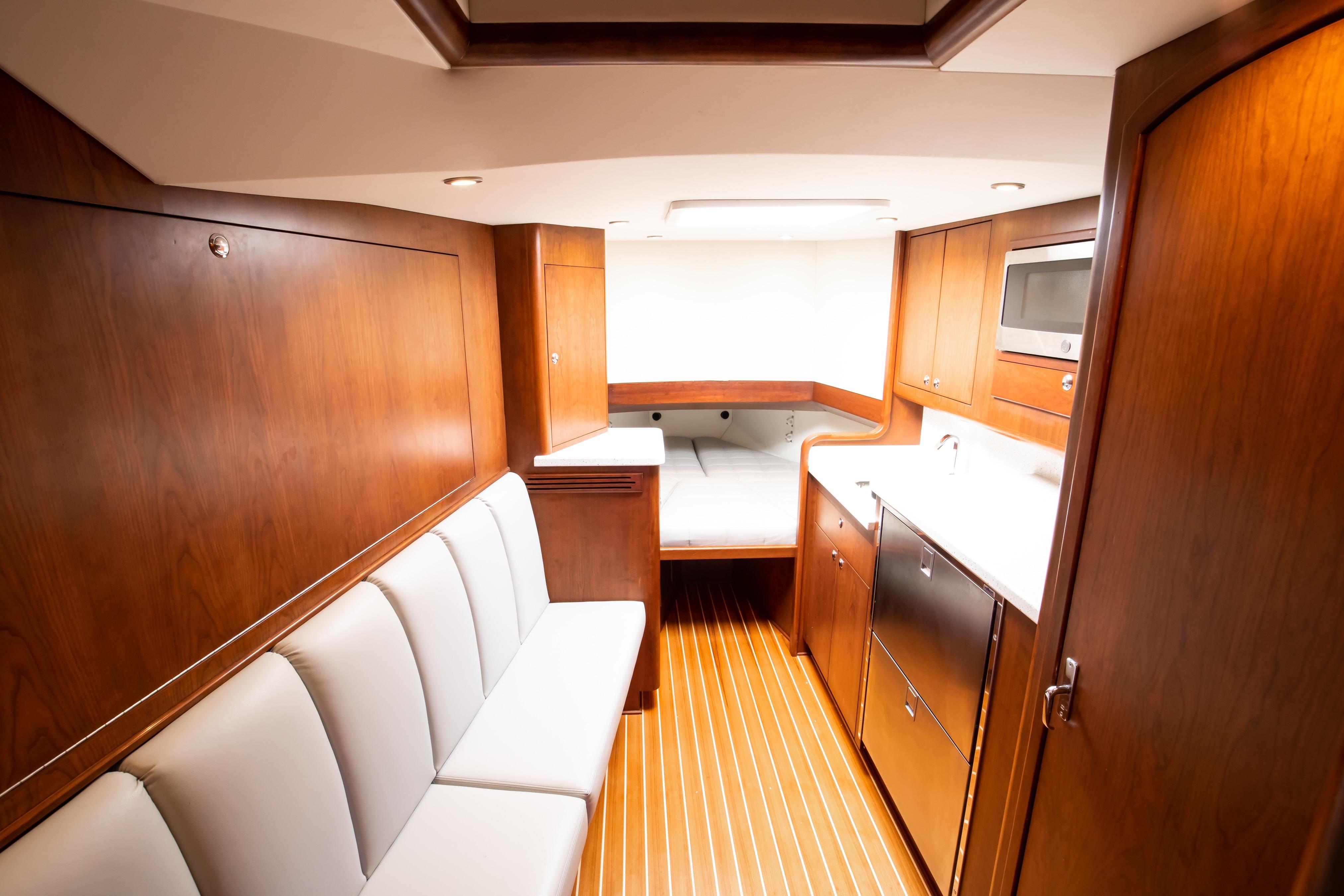 Luxurious interior of 2026 Release Boatworks 46 Walkaround with wood finish and modern amenities.