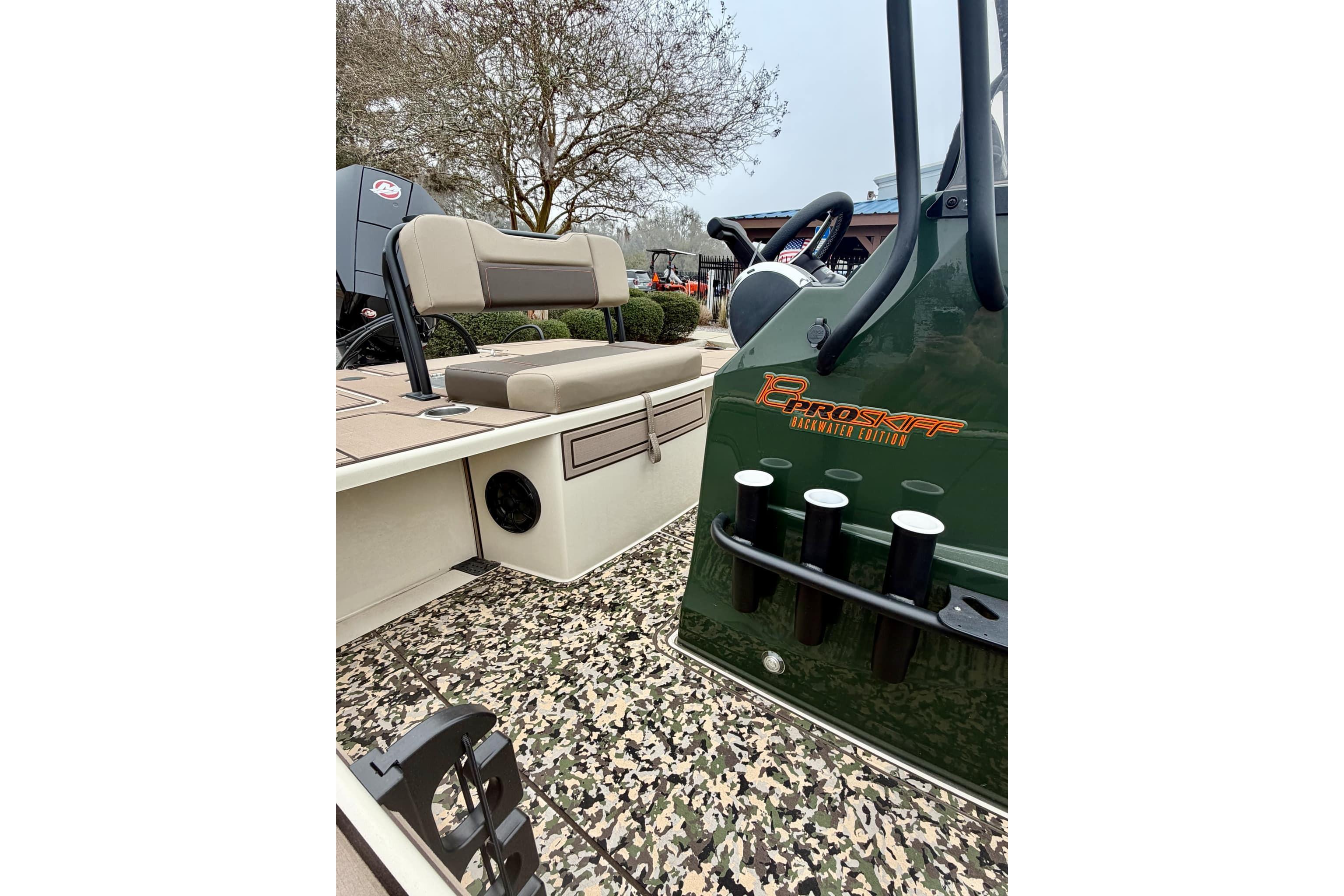 2025 Mako 18 Pro Skiff Backwater Edition with camo flooring and seating.