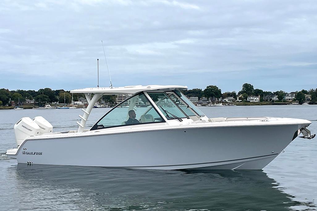 2025 Sailfish 316 DC boat on calm water, side view.