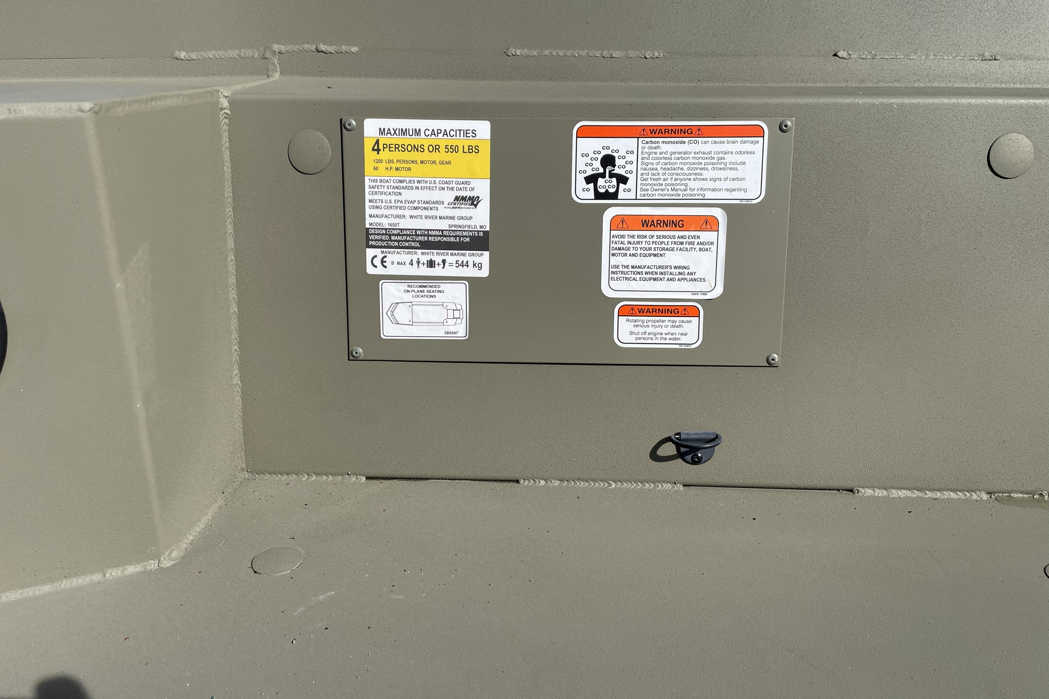 2026 Tracker Grizzly 1650 T Prairie Wings Edition capacity and safety warning labels.