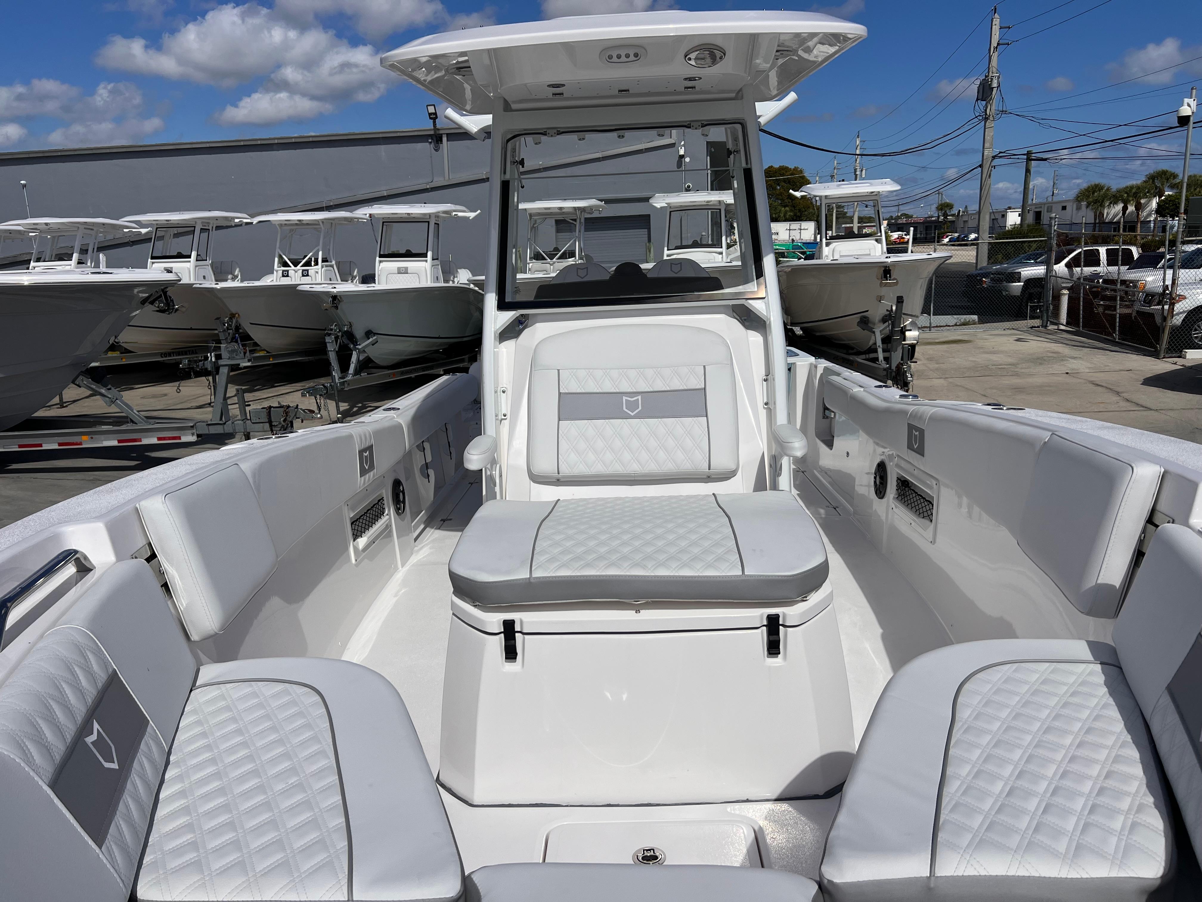 2025 Sea Fox 268 Commander boat interior with white seating and modern design.