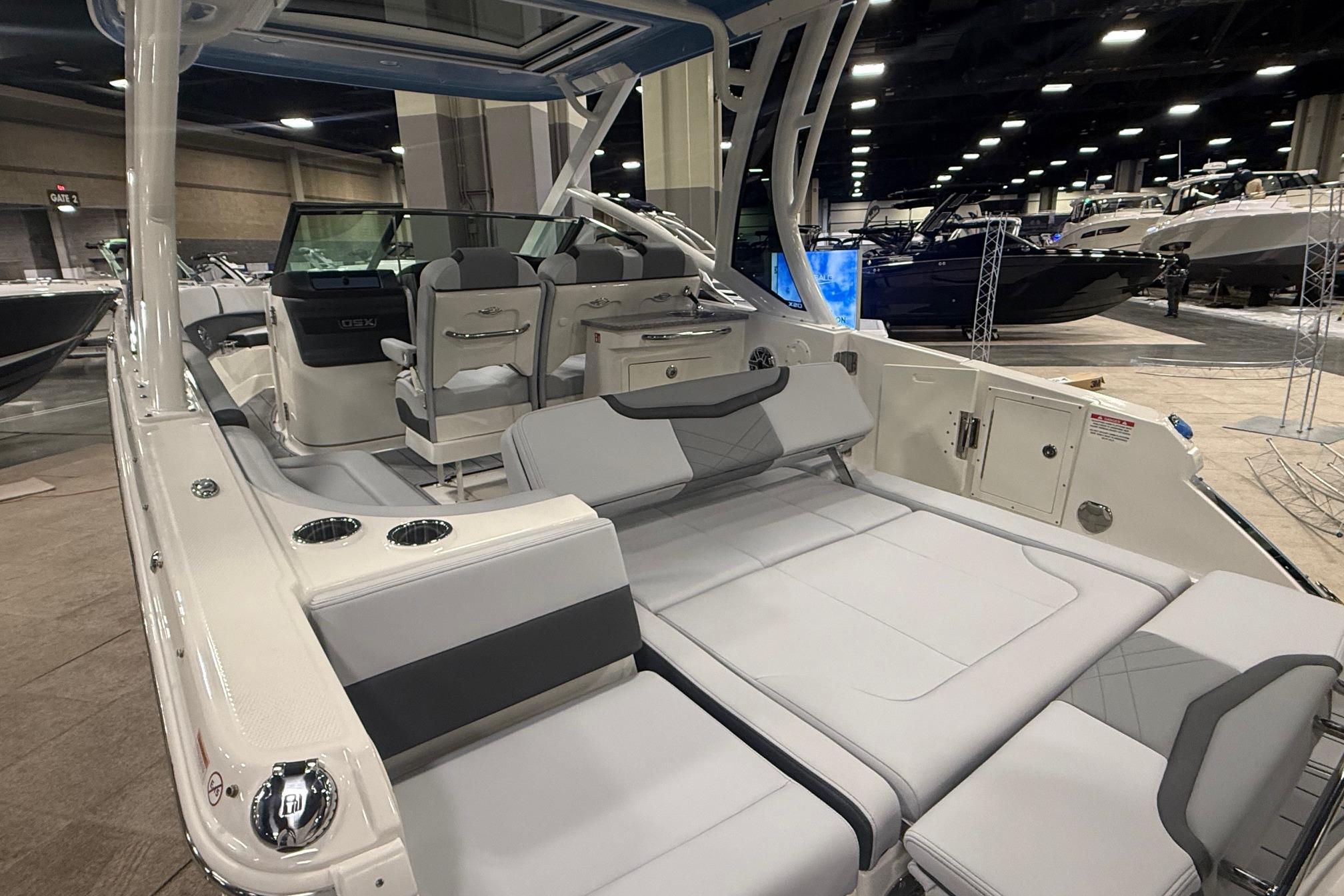 2026 Chaparral 280 OSX boat interior with luxurious seating at a boat show.
