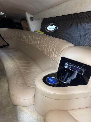 Luxurious interior of a 2005 Cobalt 343 boat with beige leather seating.