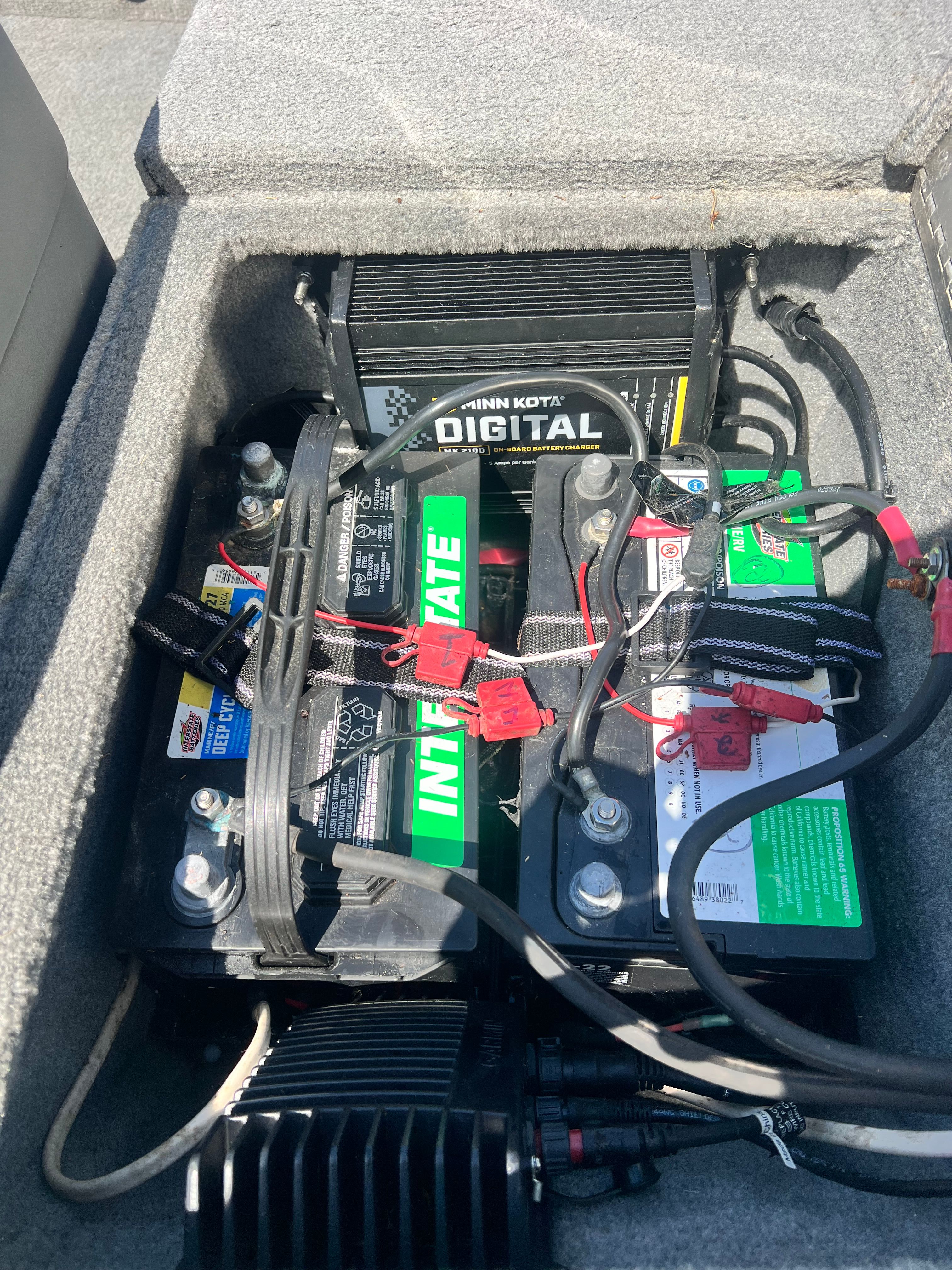 Batteries and charger in a 2007 Bass Tracker Pro 170 boat.