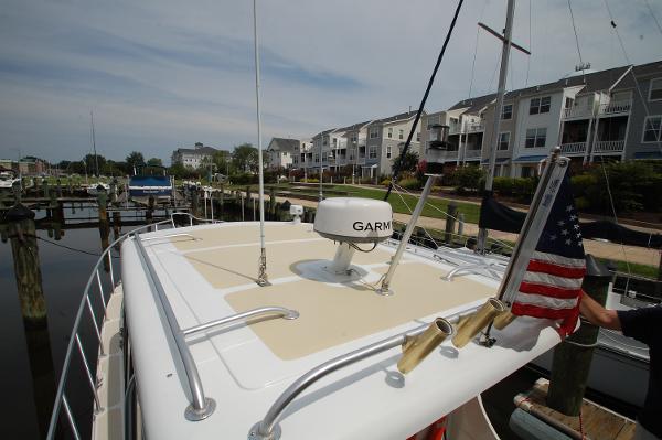 A 2005 Fox Island Thirty Sedan Cruiser docked at a marina.