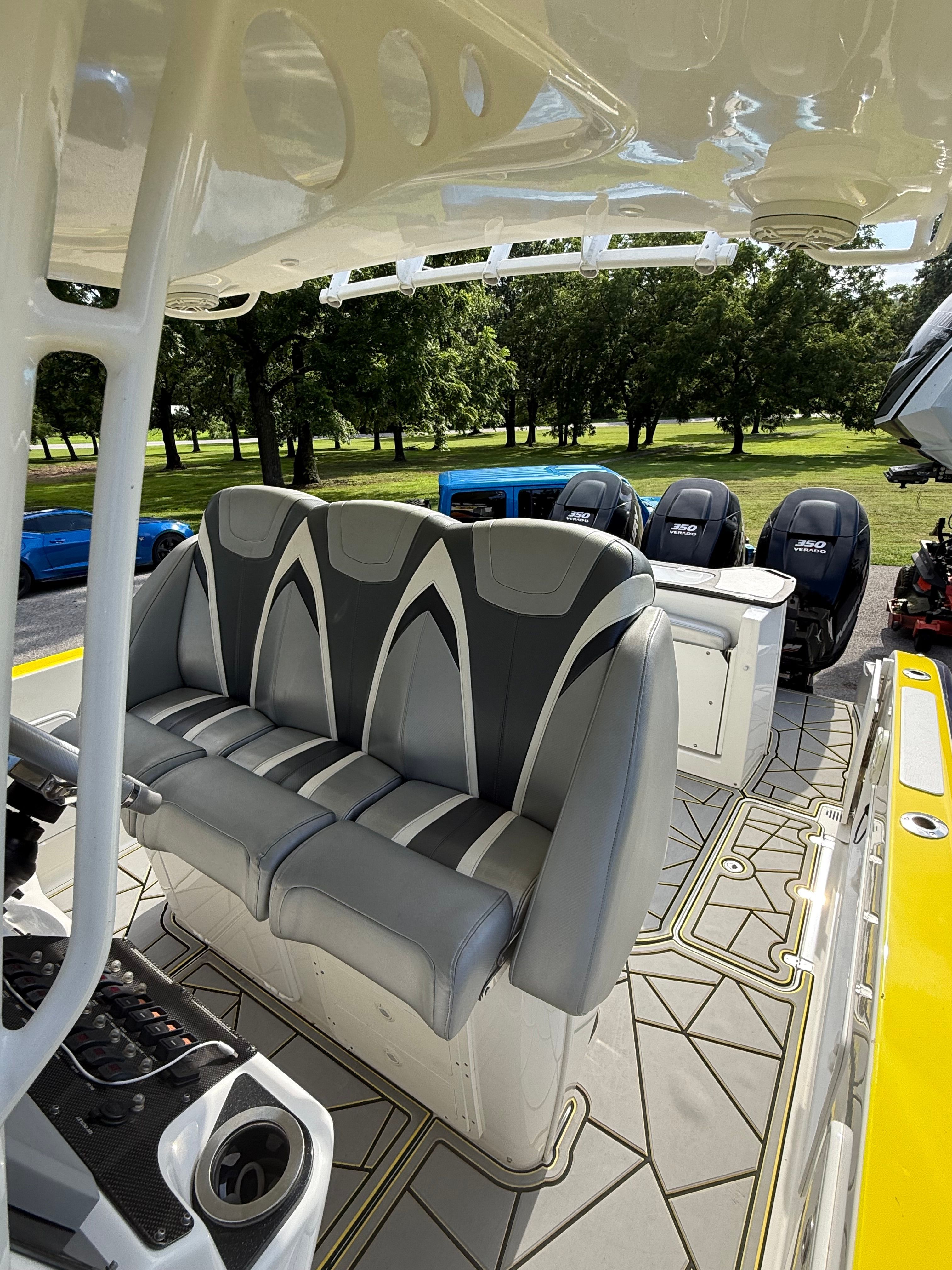 The image shows the cockpit of a 2014 Sunsation 34 CCX with gray and black seating.