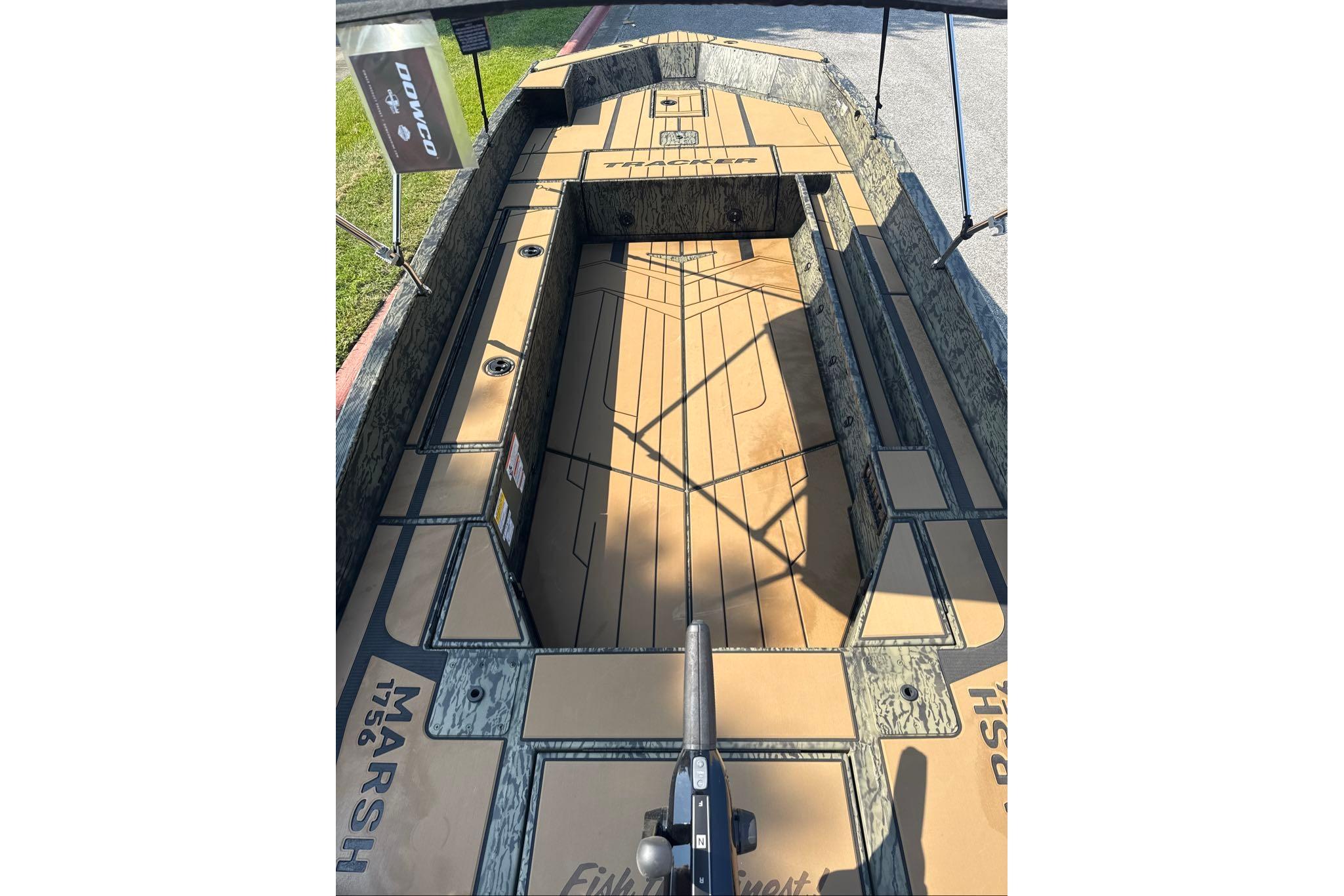 2026 Tracker Grizzly 1756 T Marsh boat interior with camo design and spacious layout.
