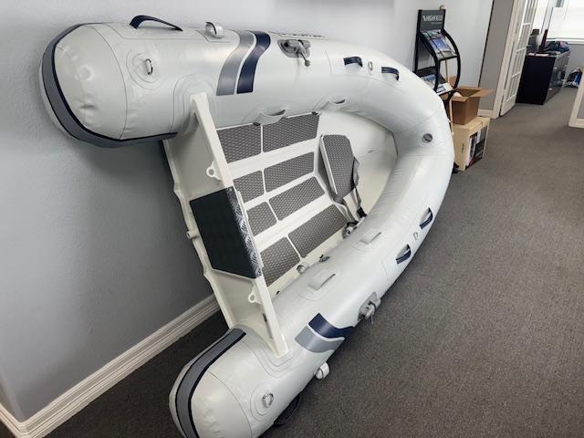 2025 Highfield Ultralite 240SS inflatable boat displayed indoors.