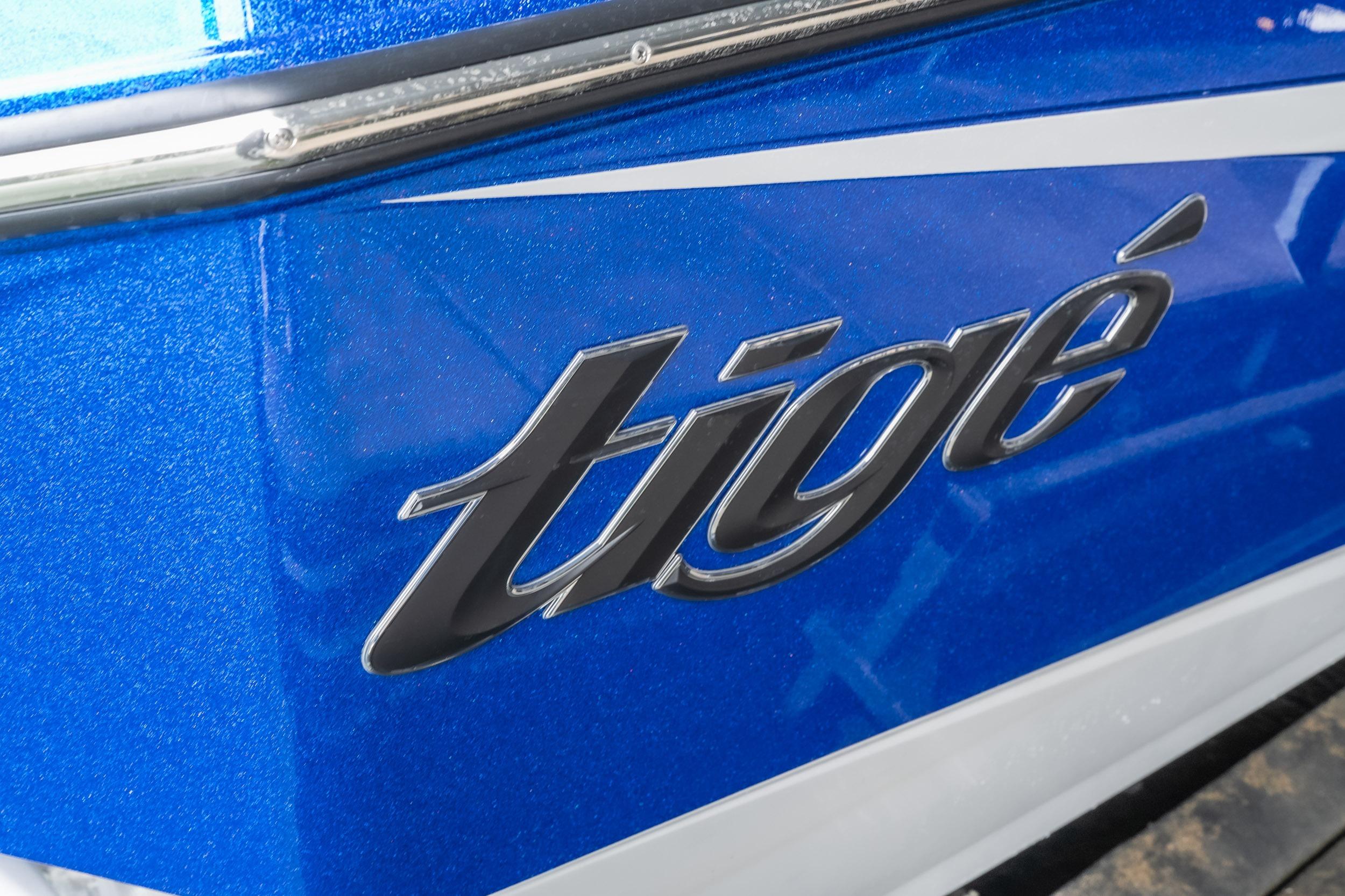 Close-up of 2026 Tigé Z3 boat logo on blue exterior.