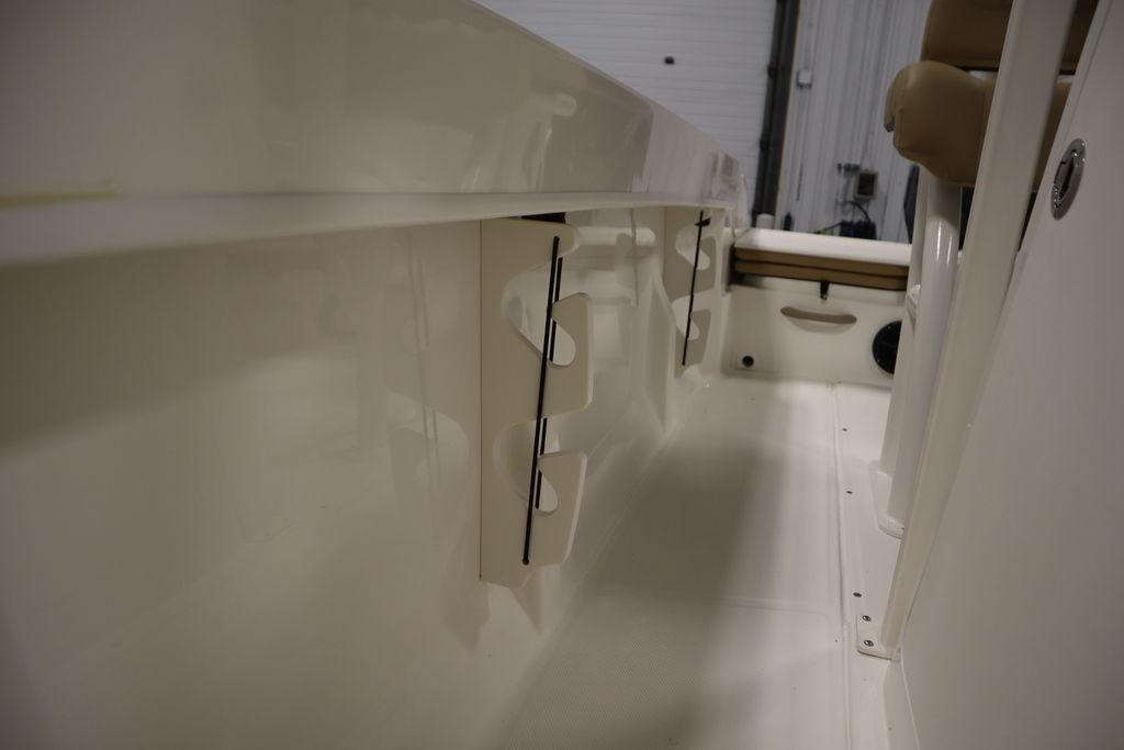 2026 Bayliner Trophy T20CC interior view, showcasing rod holders and seating area.