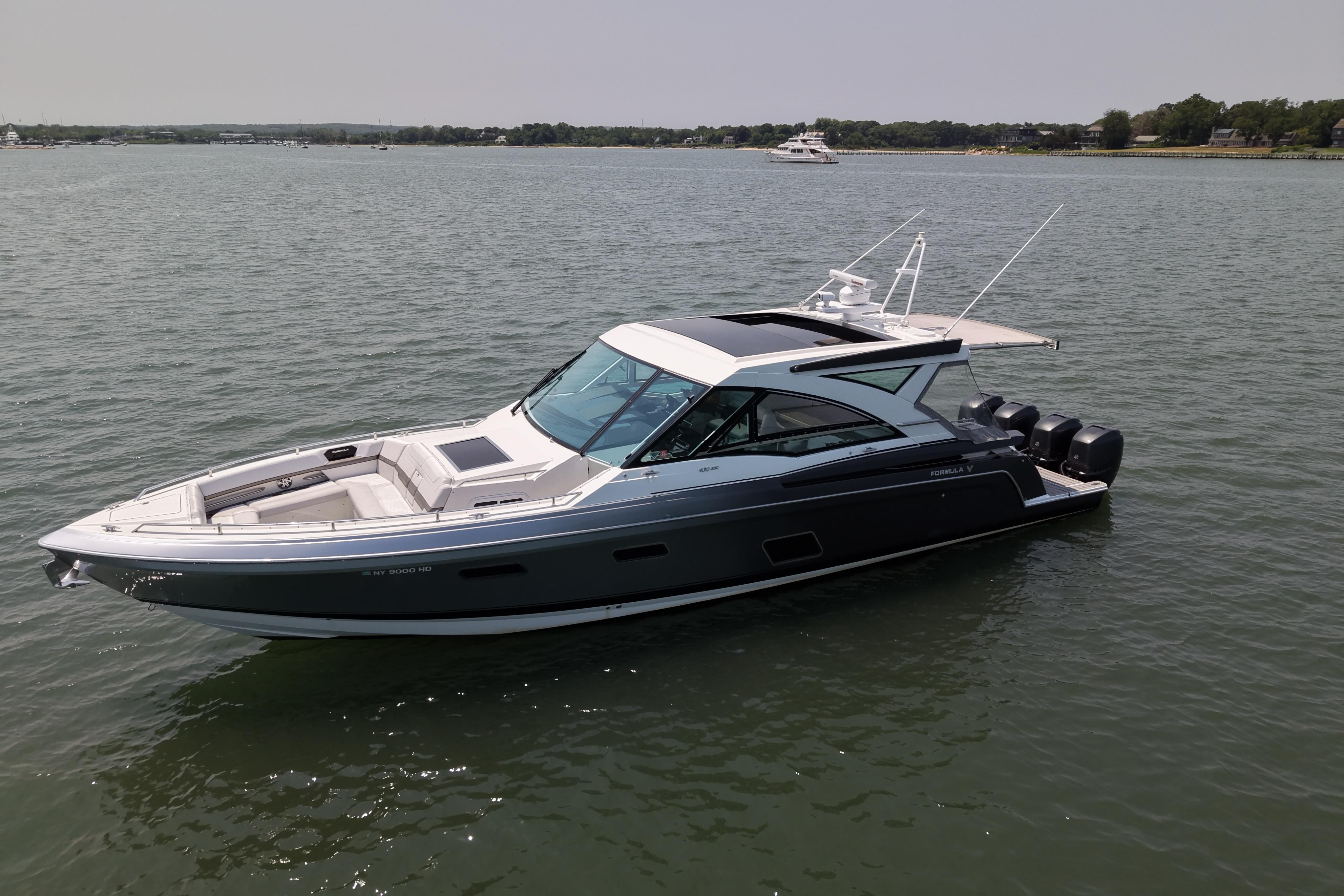 2019 Formula 430 Super Sport Crossover boat on calm water, showcasing sleek design and luxury features.