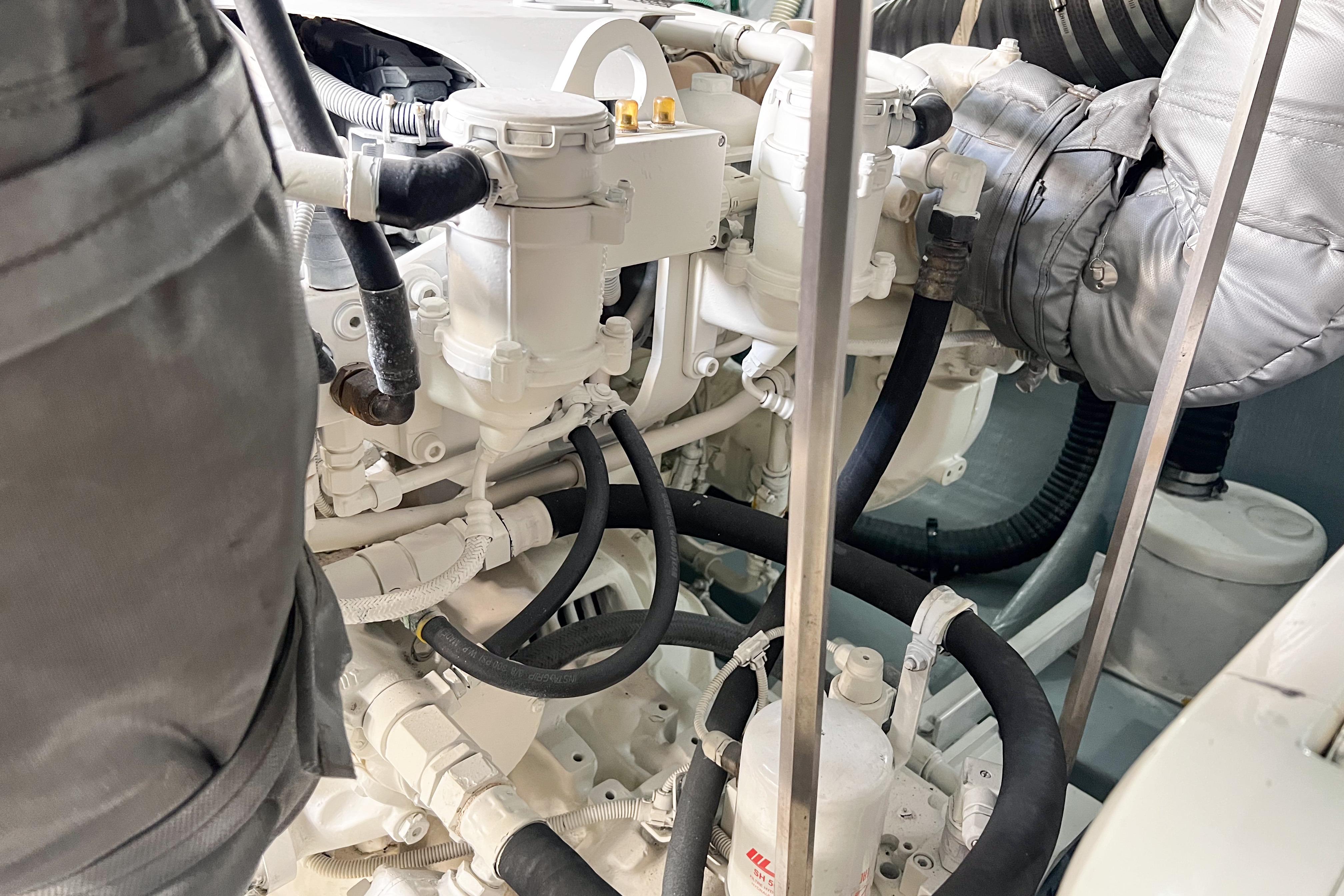 Engine room of a 2007 Sunseeker Manhattan 66 yacht, showcasing mechanical components.