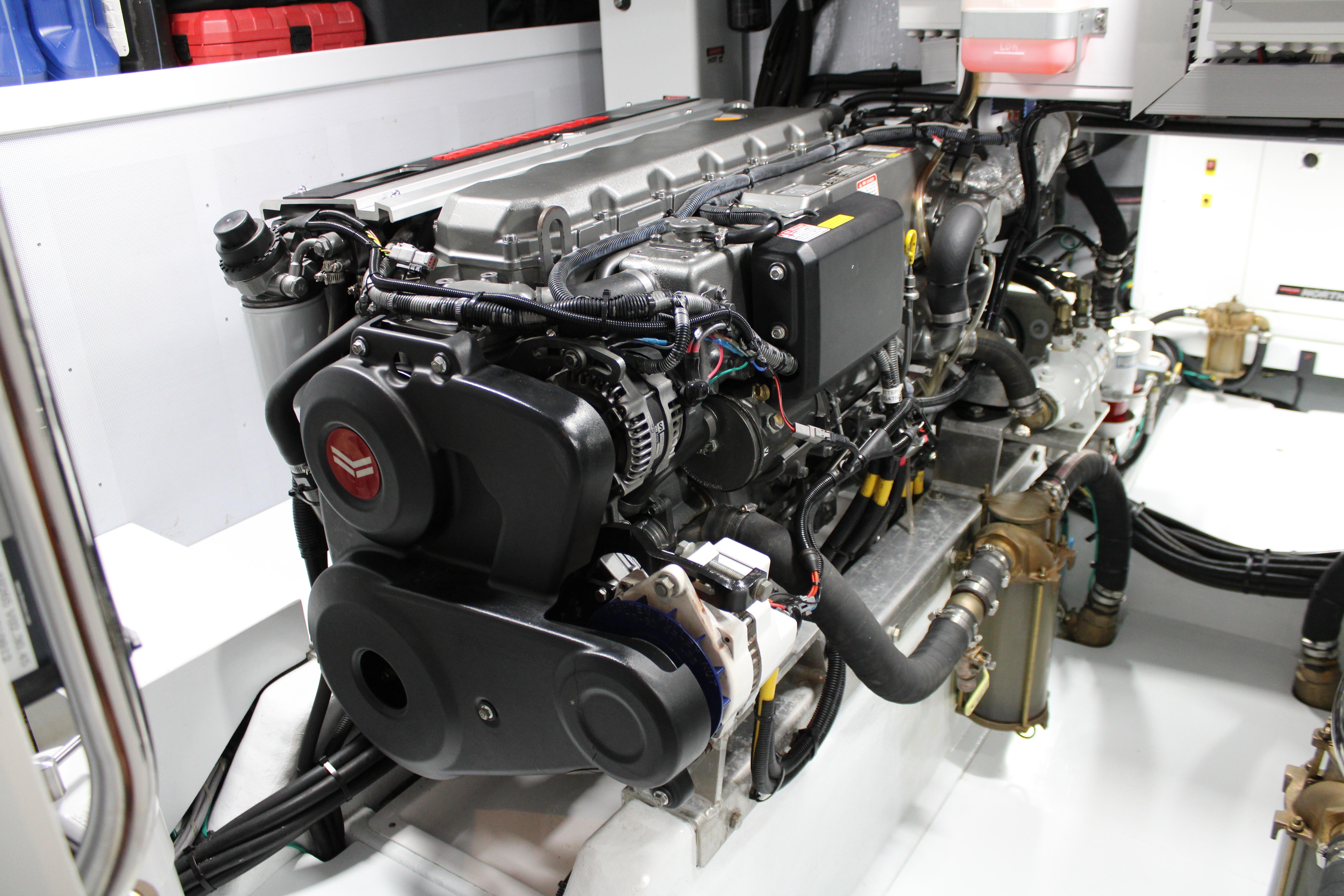 Engine room of 2023 Krogen Express 52' yacht, showcasing advanced marine engine components.