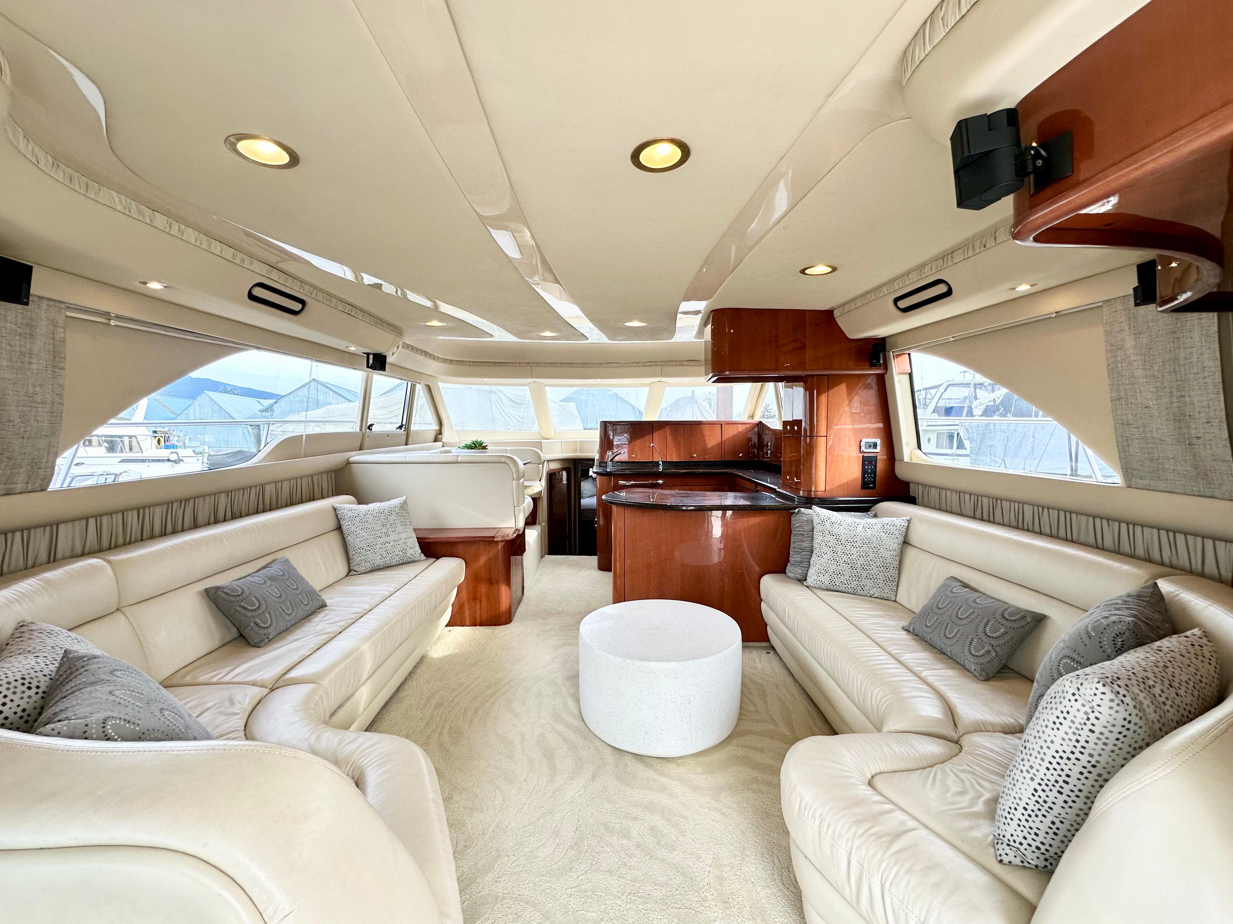 Luxurious interior of a 2002 Sea Ray 560 Sedan Bridge yacht with elegant seating and modern design.