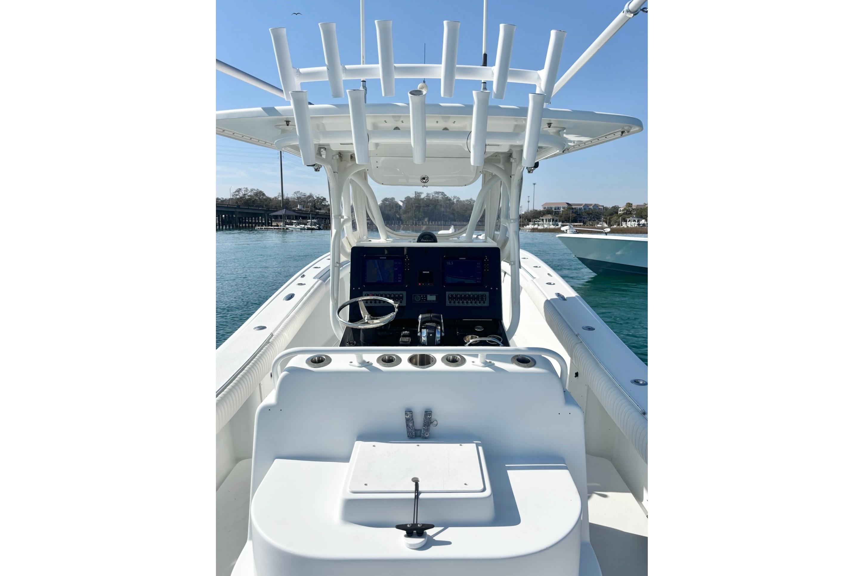 2007 Yellowfin 36 Offshore boat cockpit with steering wheel and navigation equipment.