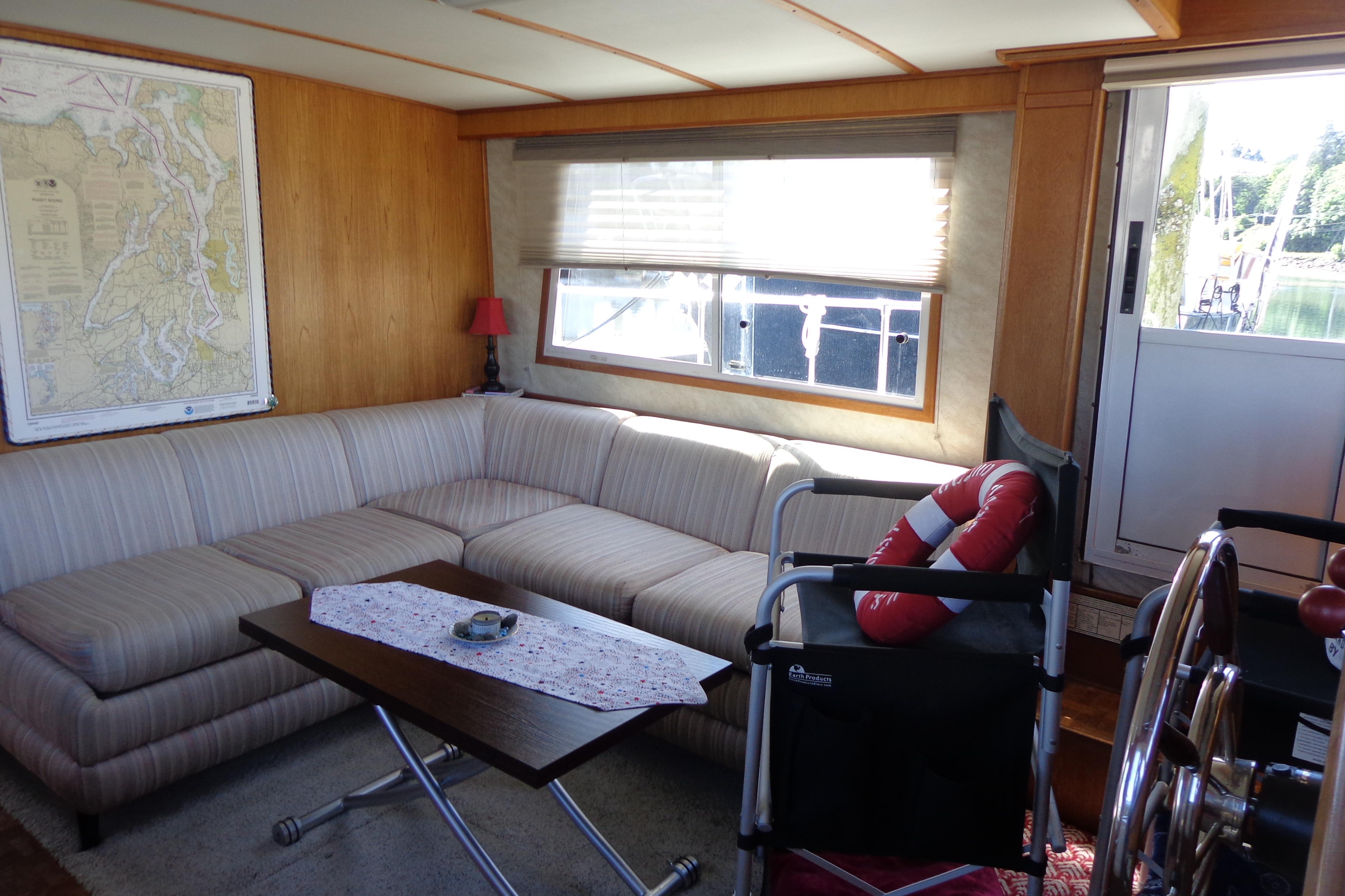 Interior of 1992 Cruise-A-Home Corsair 4200 with cozy seating and nautical decor.