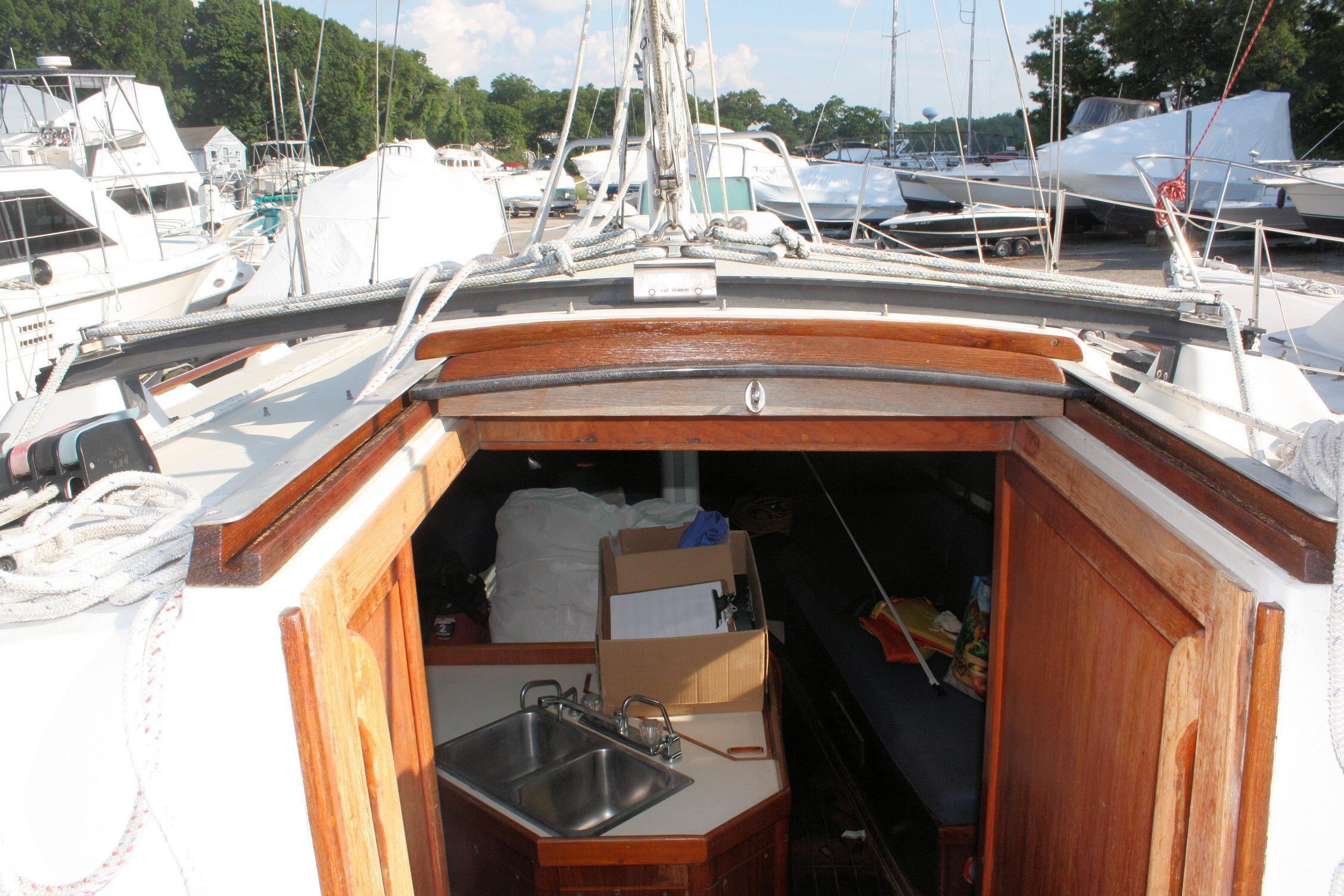 Interior view of 1987 Ericson 38-200 sailboat with open cabin and visible sink.