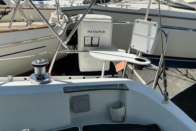 Beneteau Oceanis 321 sailboat cockpit, featuring winch and safety equipment, year 2000 model.
