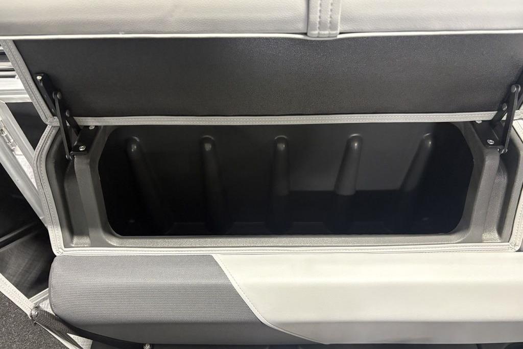 Open storage compartment in 2026 Sun Tracker PARTY BARGE® 20 DLX pontoon boat.