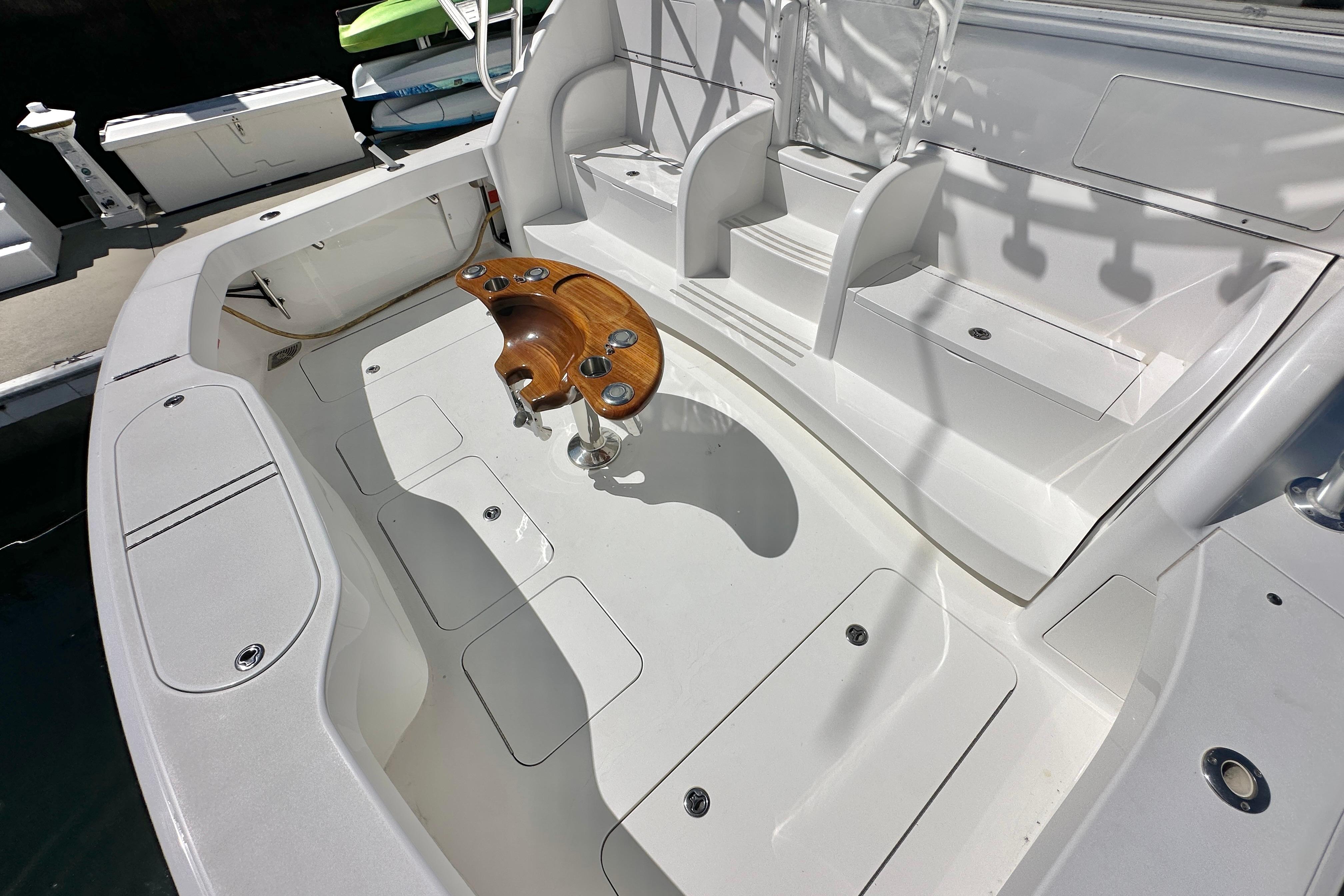 2012 Viking 42 Open boat cockpit with seating and wooden fishing rod holder.
