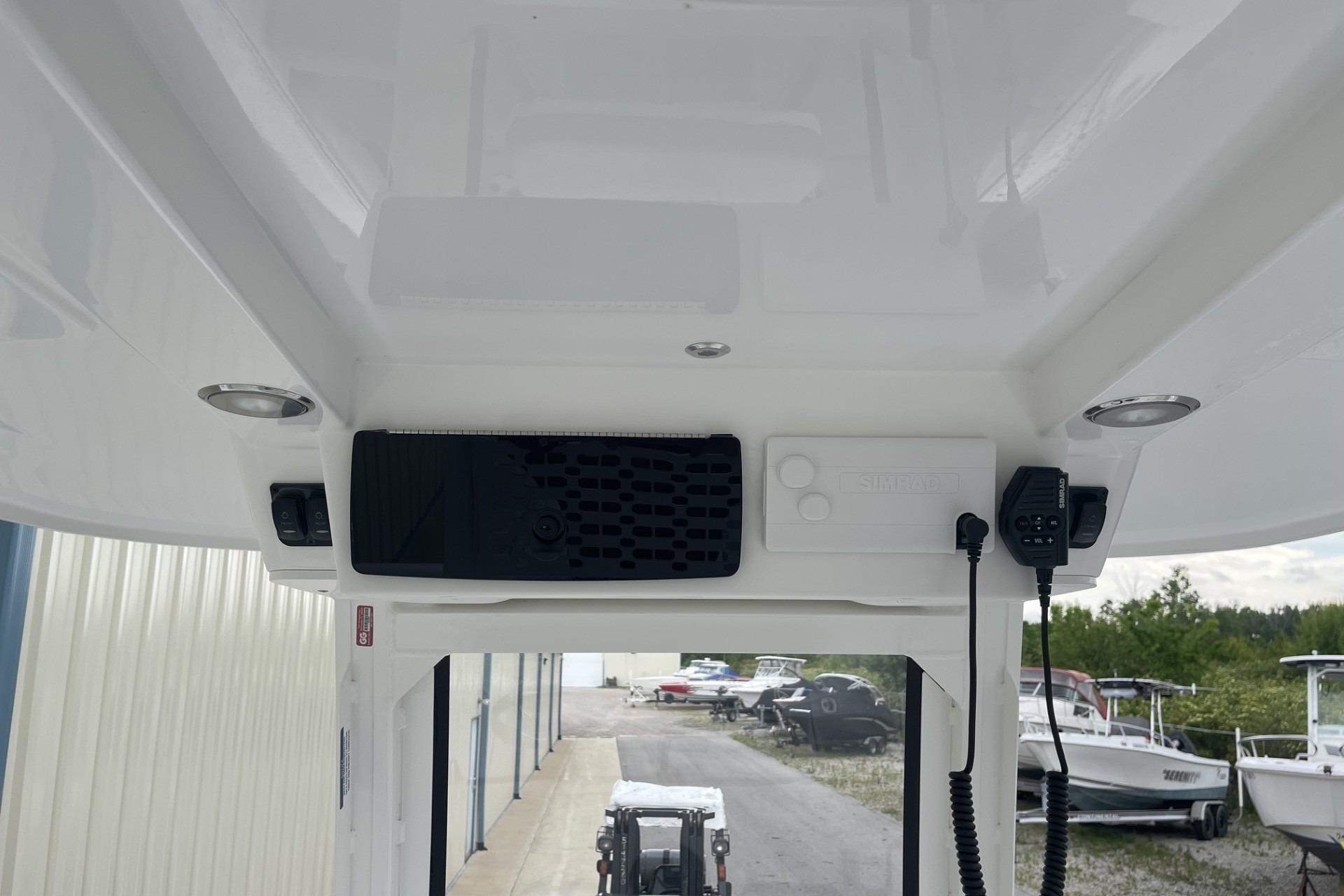 2026 Hurricane Center Console 24 OB boat interior with electronic controls and communication equipment.