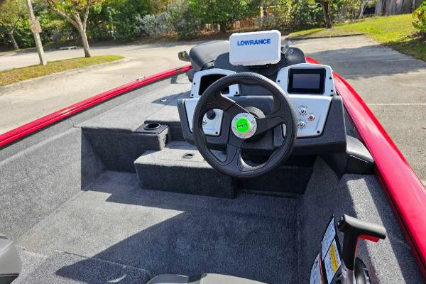 2025 Tracker Pro Team 175 boat interior with steering wheel and Lowrance electronics.