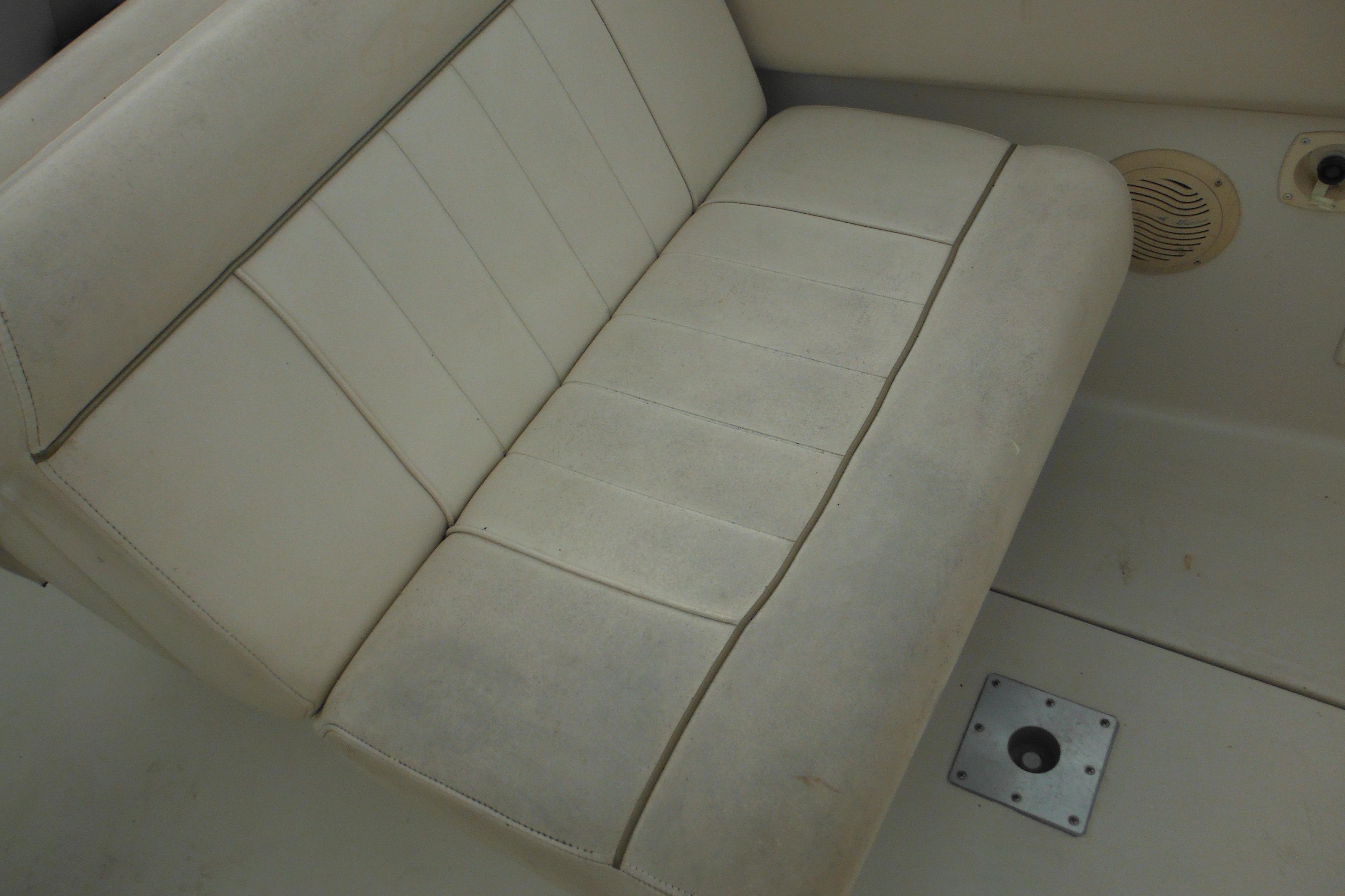 White leather seat on a 2001 Monterey 262 Cruiser boat interior.