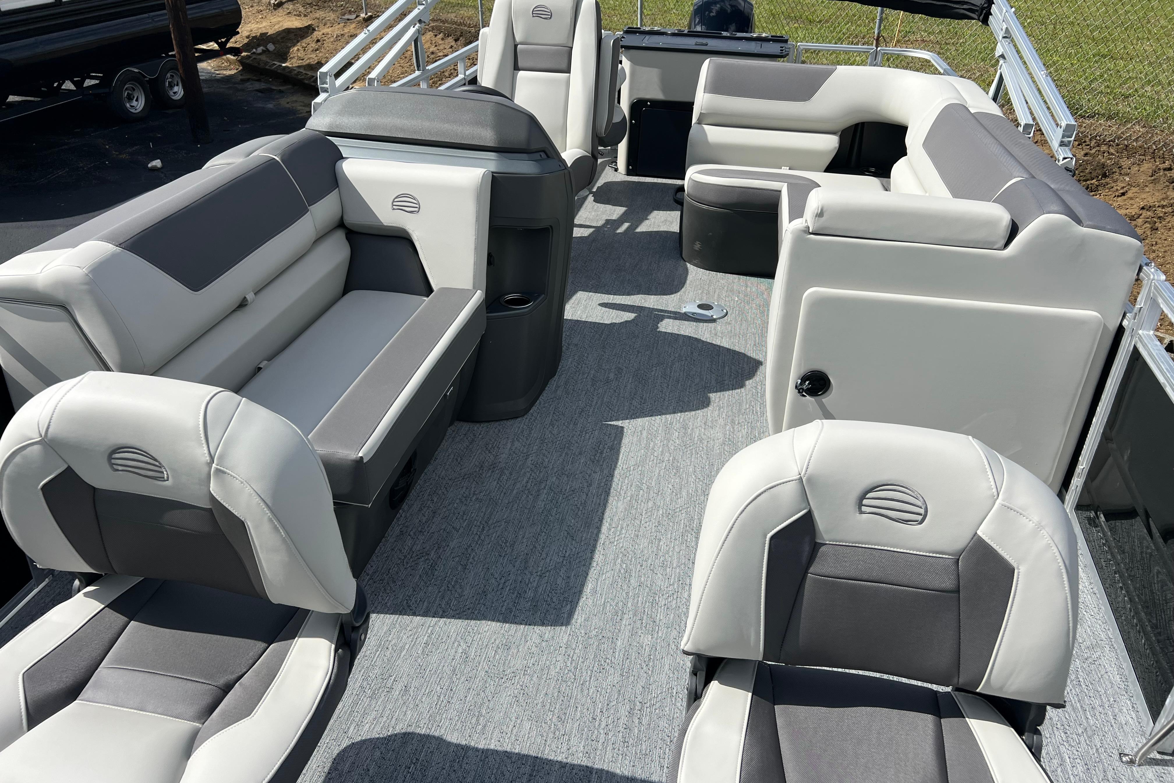 2026 Sun Tracker Fishin' Barge 22 DLX interior with spacious seating and modern design.