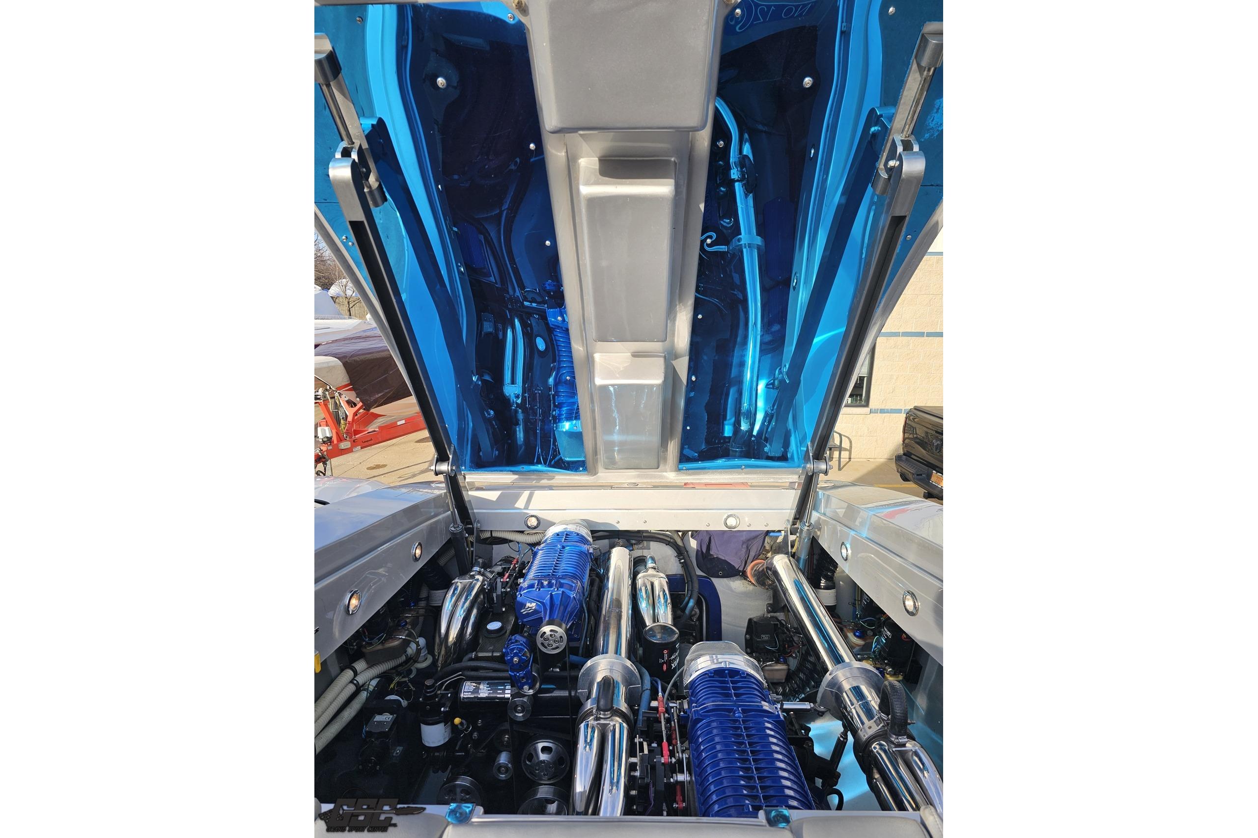Open engine compartment of a 2007 Hustler 41 Razor boat, showcasing detailed components.