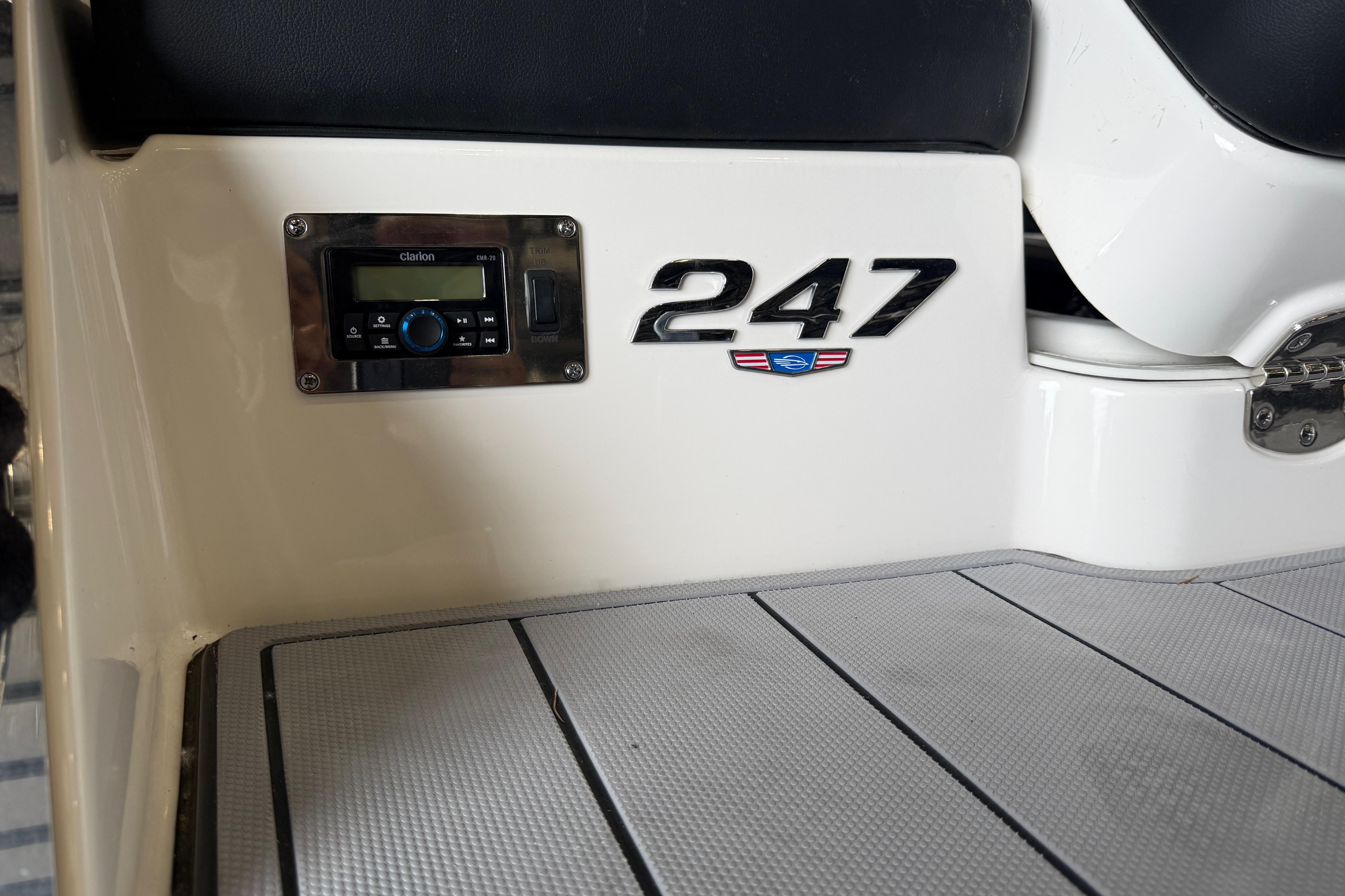 2023 Chaparral 247 SSX boat interior with Clarion audio system and model emblem.
