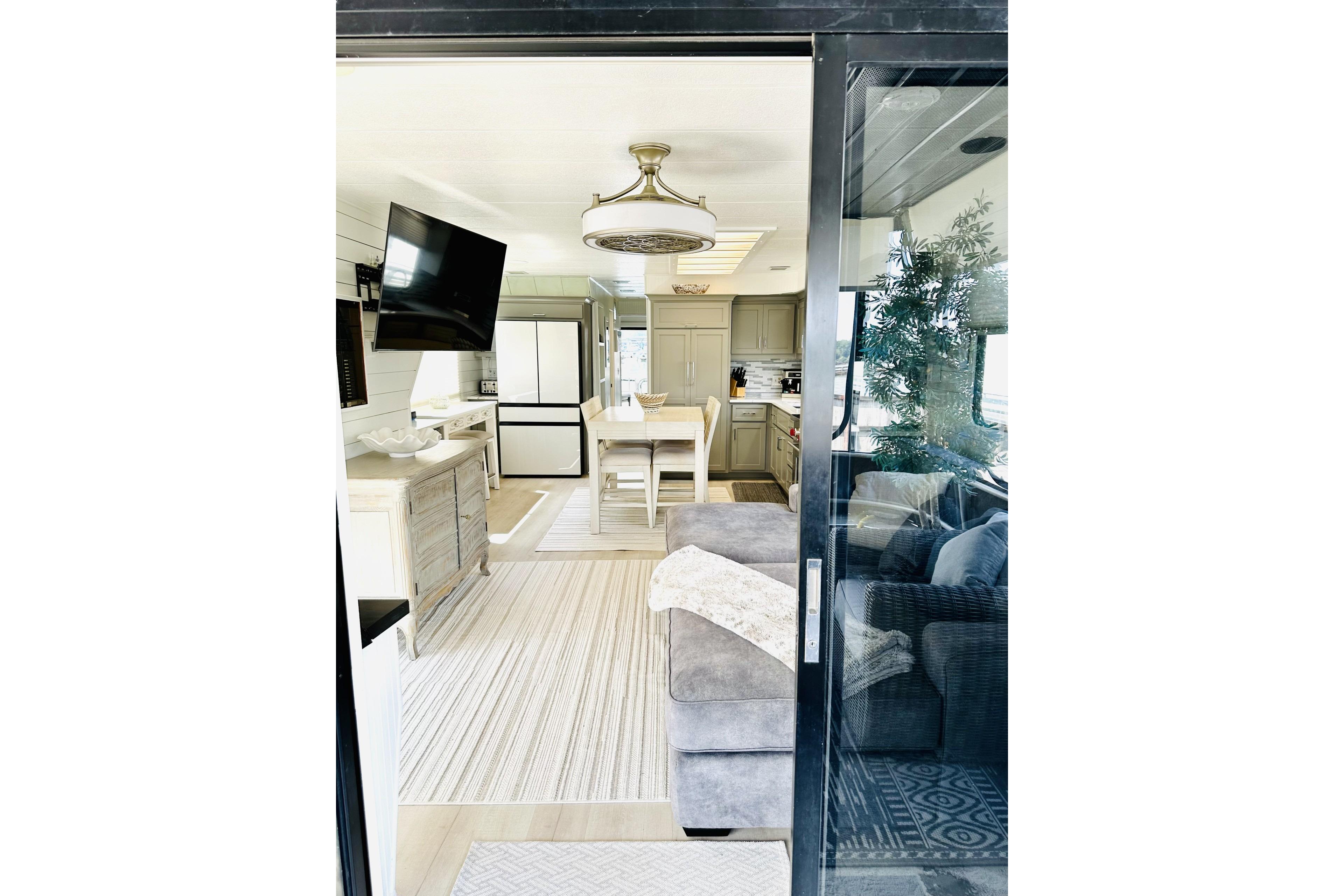 Interior of 1992 Sumerset 66 houseboat with modern kitchen and cozy living area.