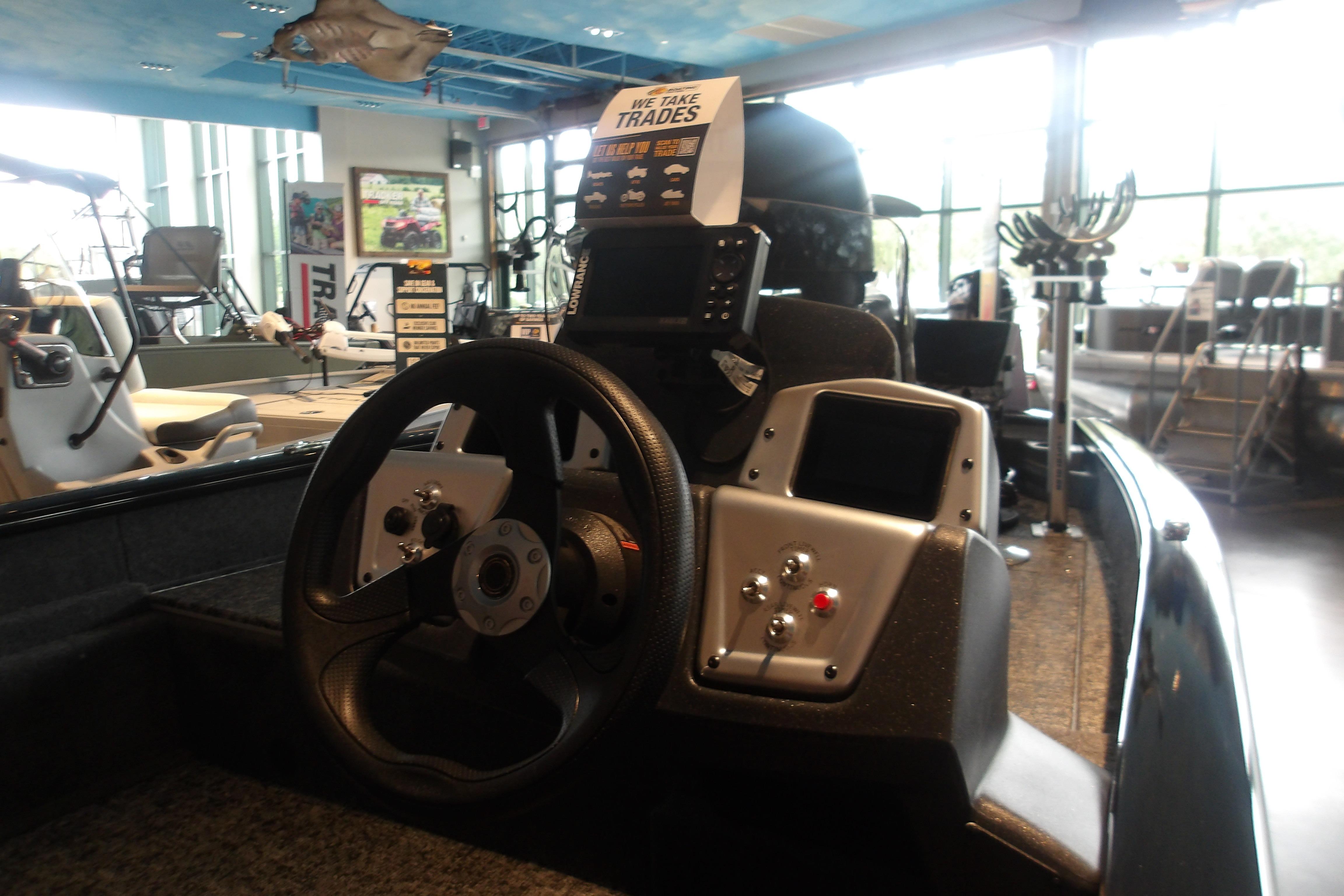 2026 Tracker Pro Team 175 Crappie Edition boat interior with steering wheel and control panel.