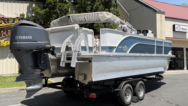 2023 SunCatcher Select 322FC pontoon boat on trailer with Yamaha outboard motor.