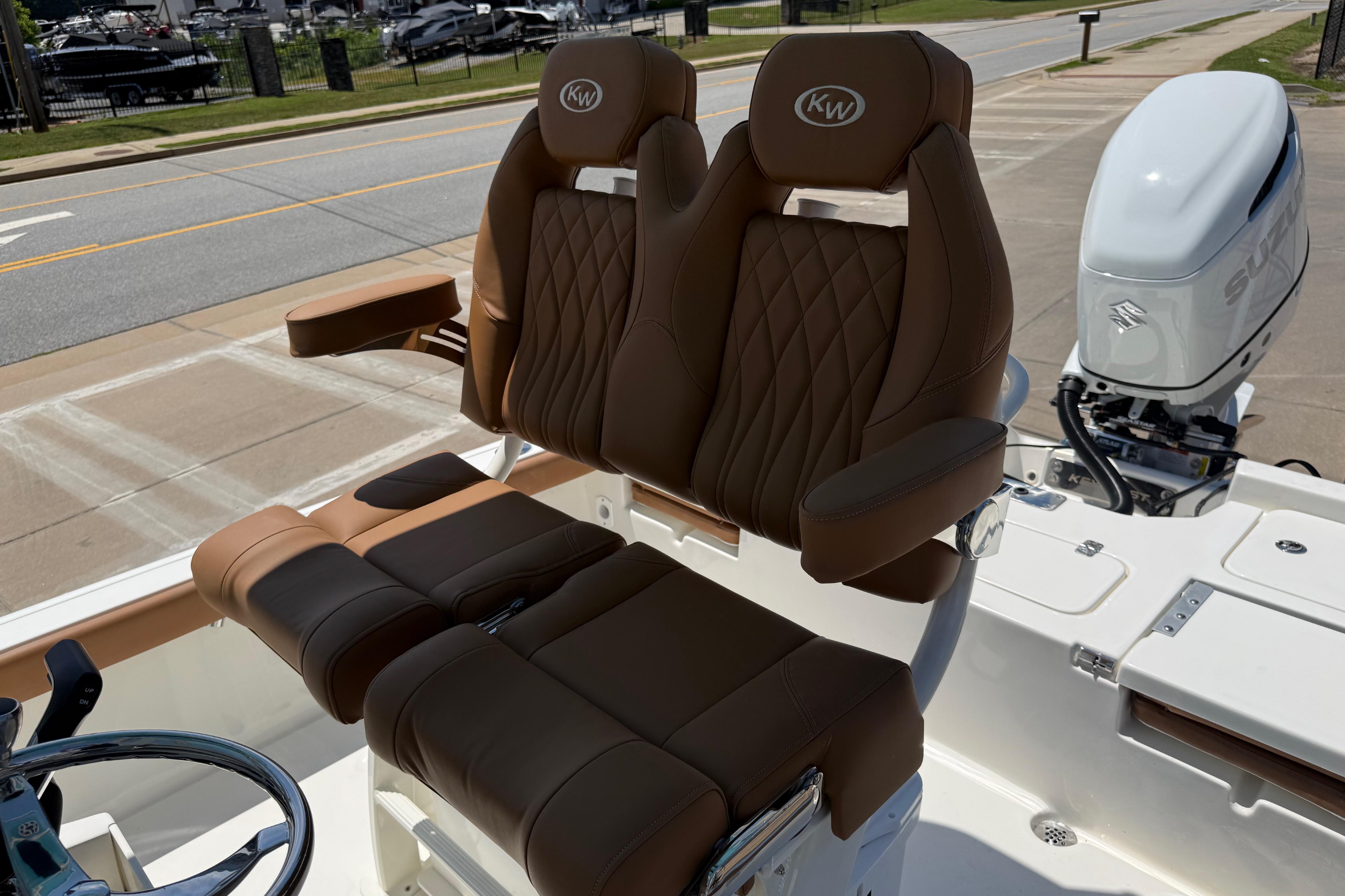 Luxurious seating on 2026 Key West 230 Bay Reef boat with Suzuki outboard motor.