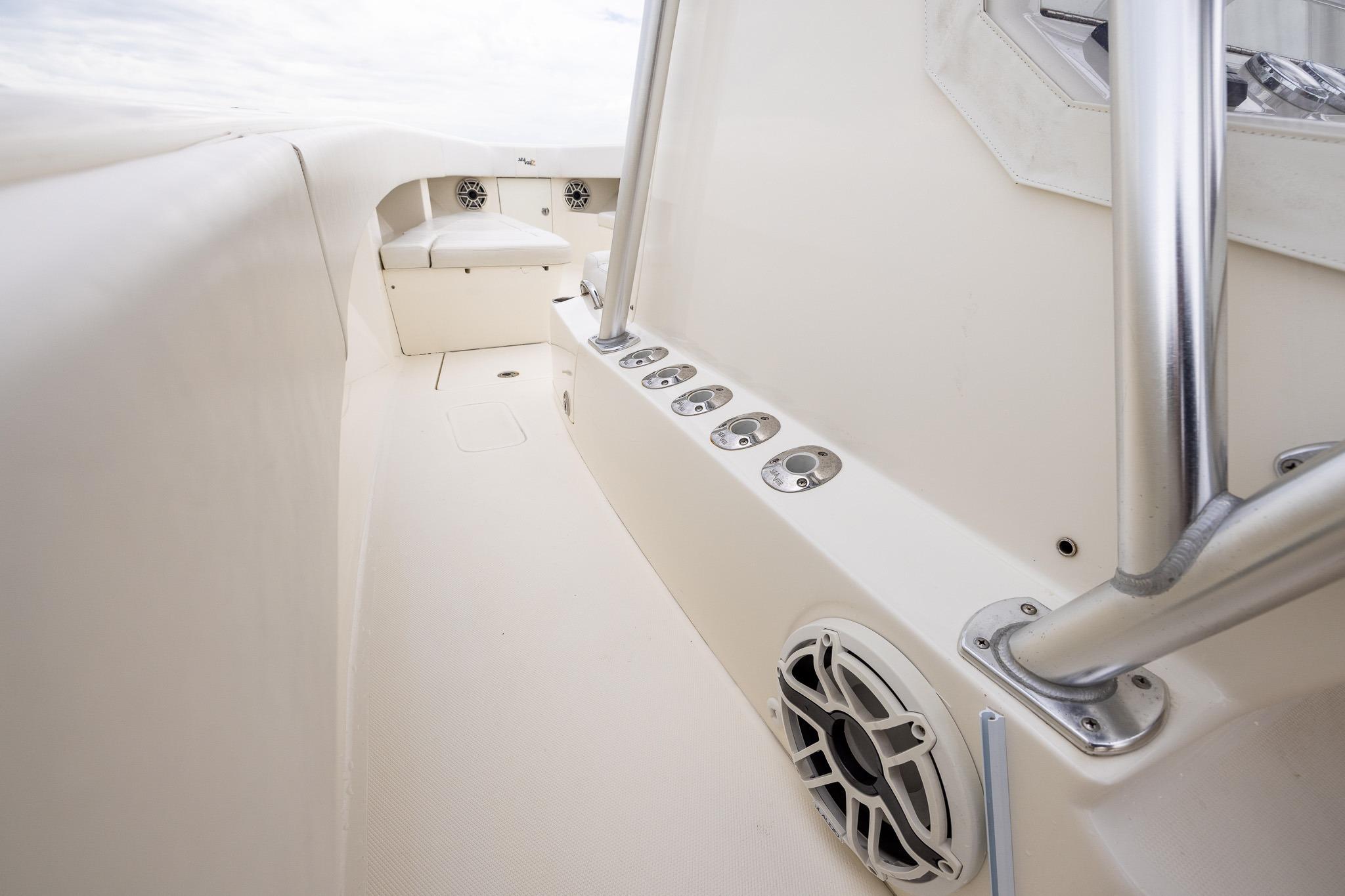 2019 SeaVee 322Z boat interior with rod holders and speaker, showcasing sleek design.