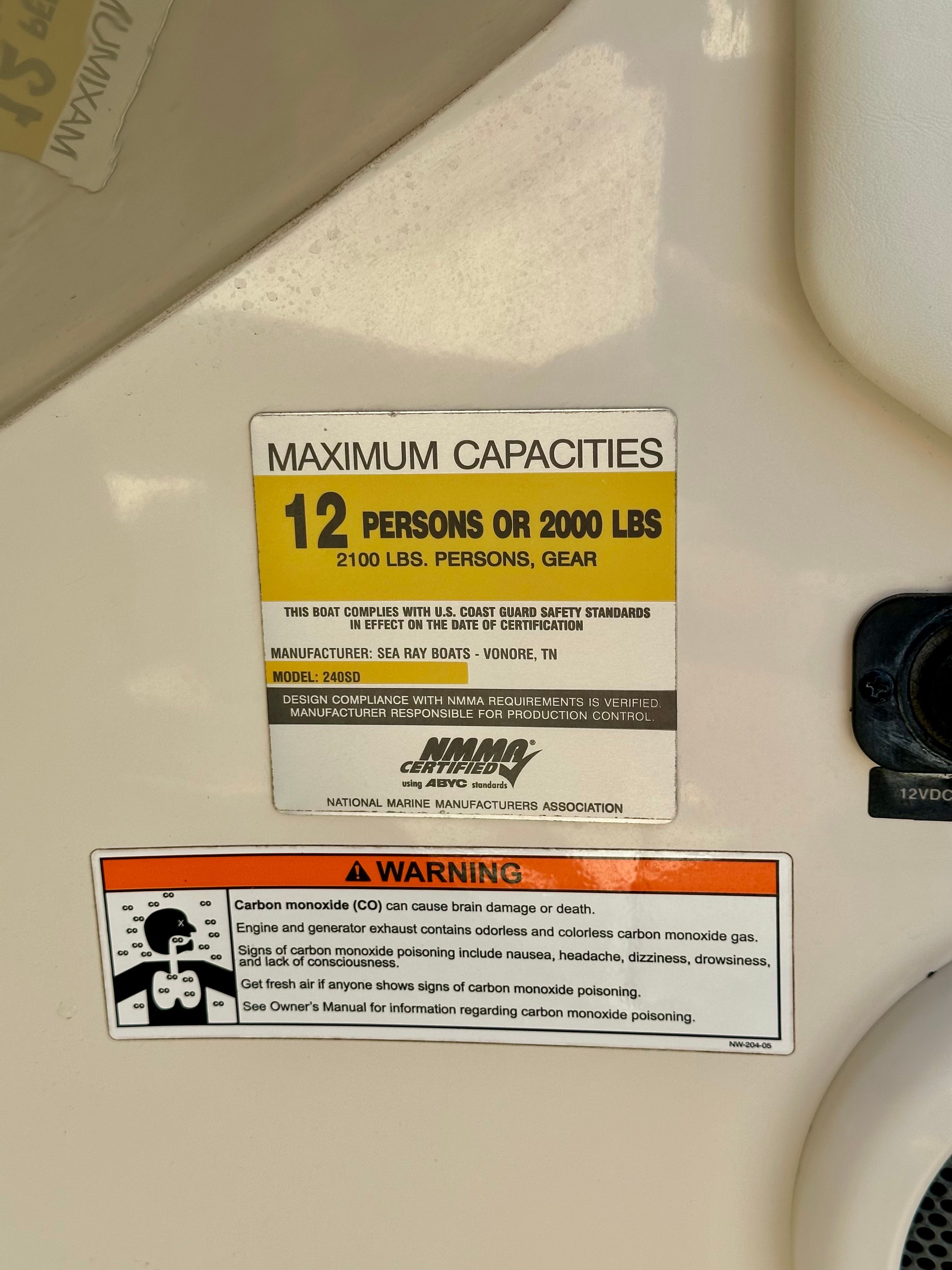 Capacity and warning label on a 2006 Sea Ray 240 Sundeck boat.