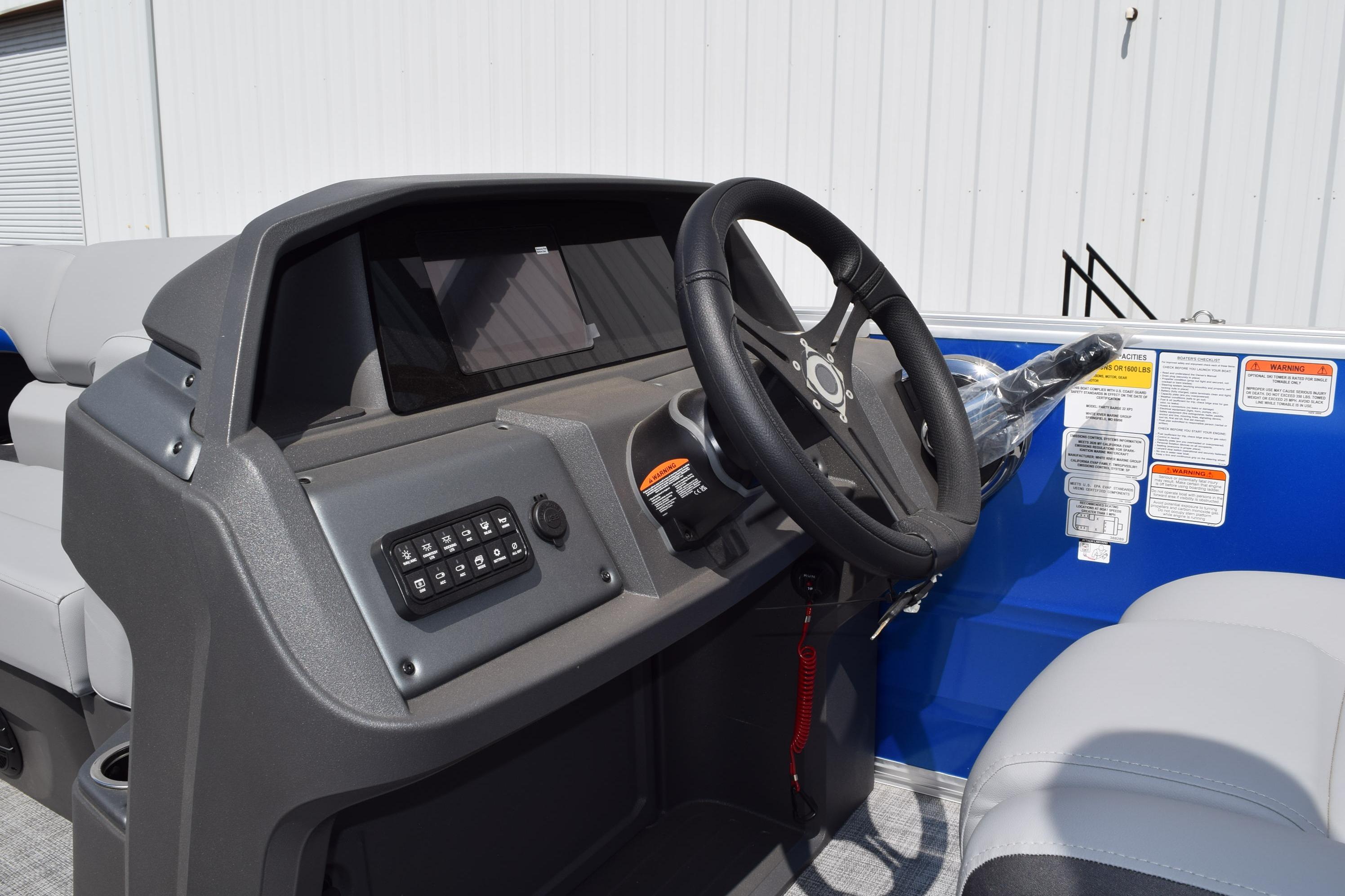 Steering console of 2026 Sun Tracker Party Barge 22 RF XP3 pontoon boat.