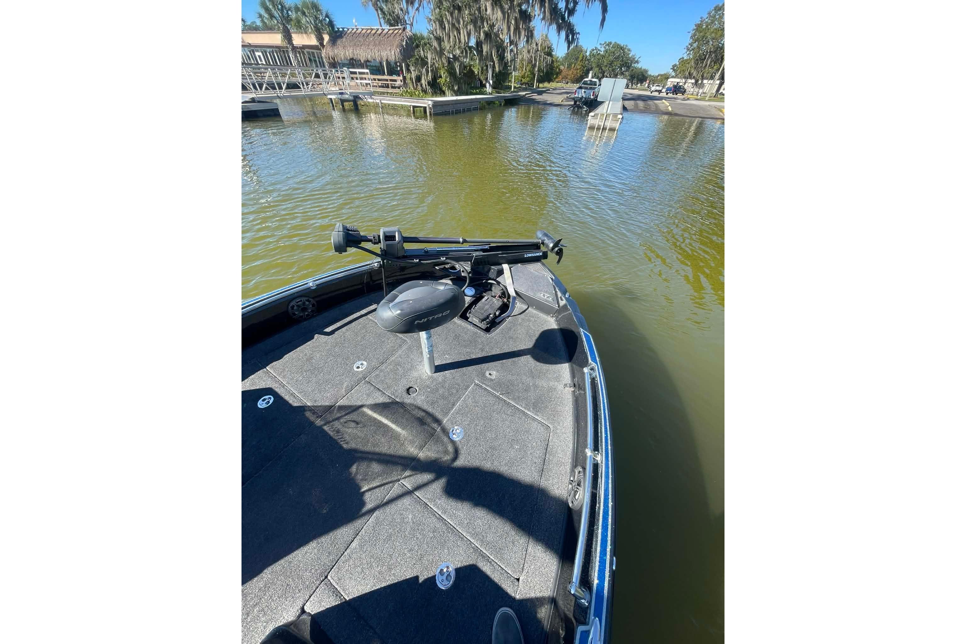 2024 Nitro ZV21 boat on calm water, featuring a sleek deck and advanced equipment.