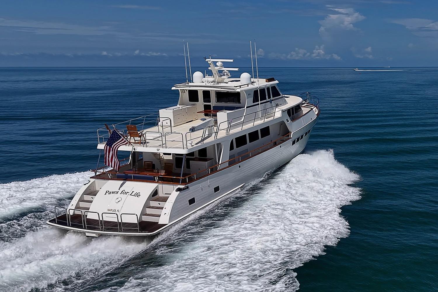 Luxurious 2014 Marlow 80 Explorer yacht cruising on open sea.